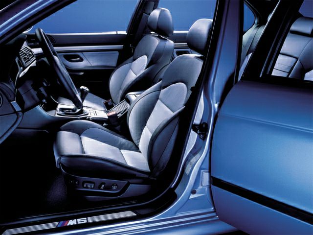 Ergonomic front seats and detailed interior of a luxury sports sedan.
