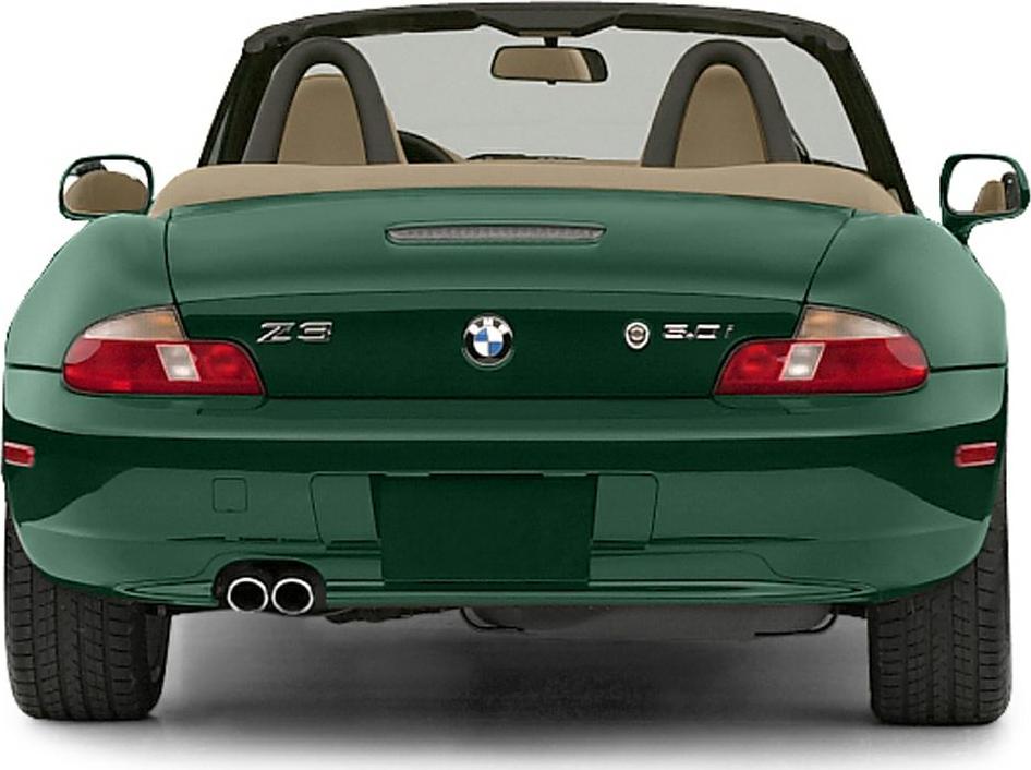 Rear view of convertible with dual exhaust and emblem details