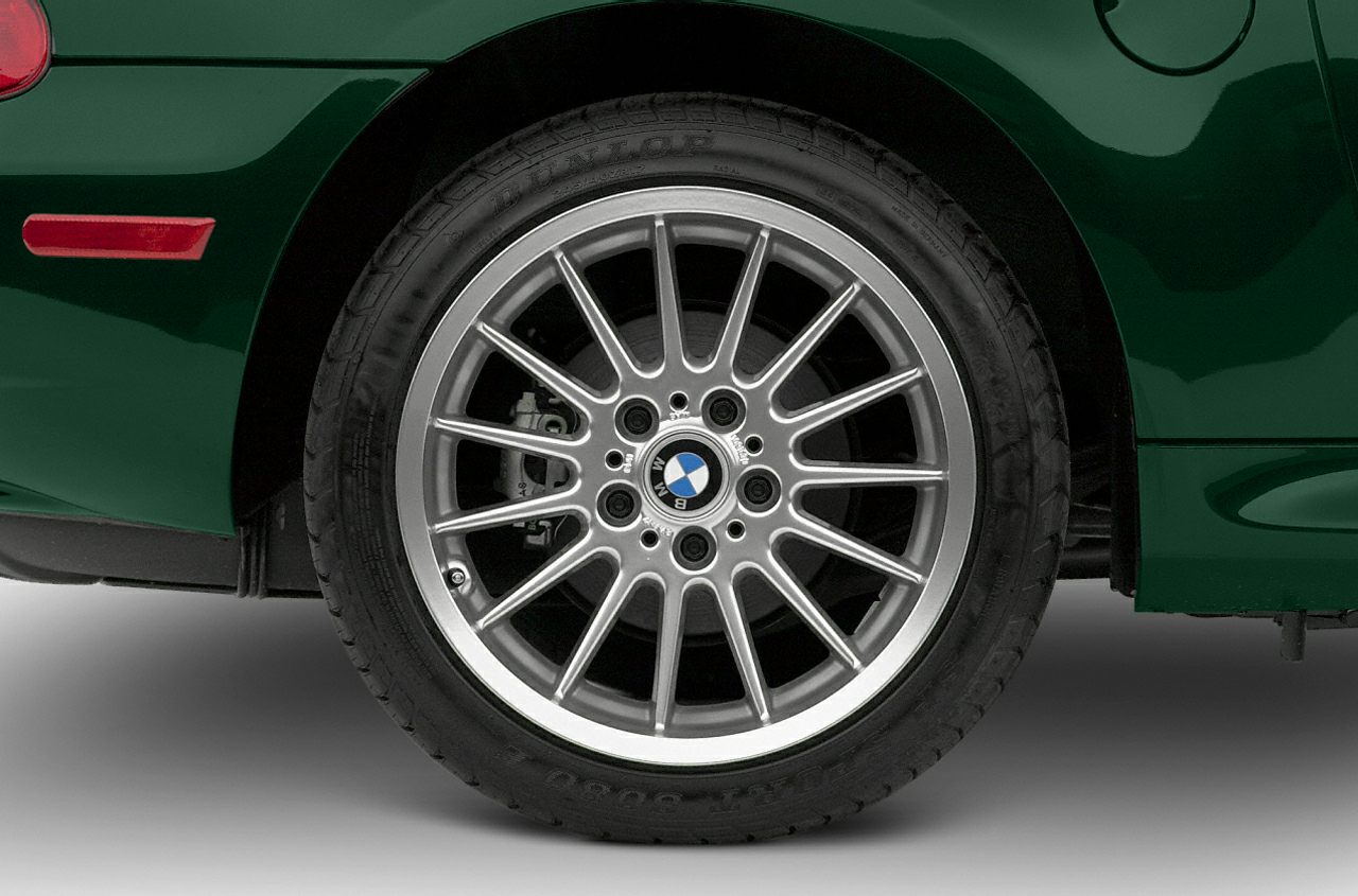 Multi-spoke alloy wheel with visible brake caliper and tire tread