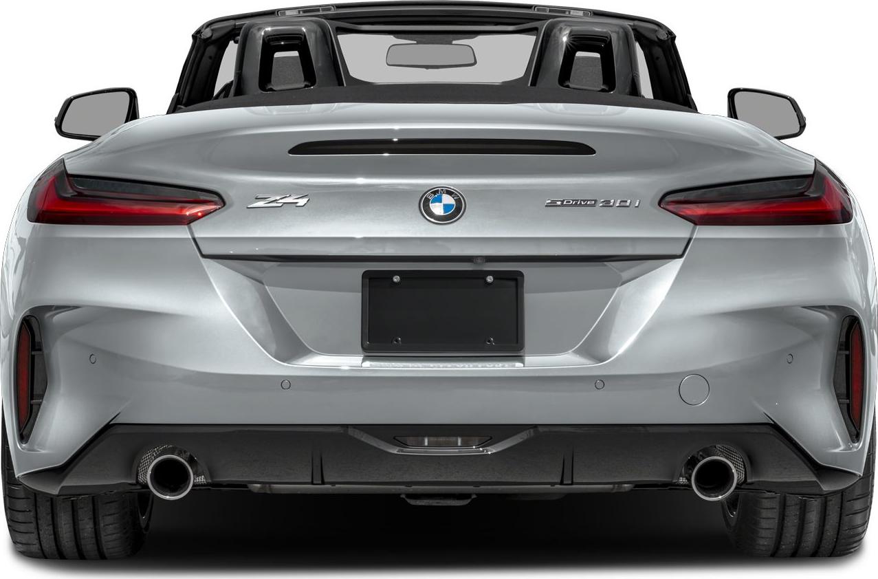 Rear view of a sleek convertible with dual exhaust and modern taillights