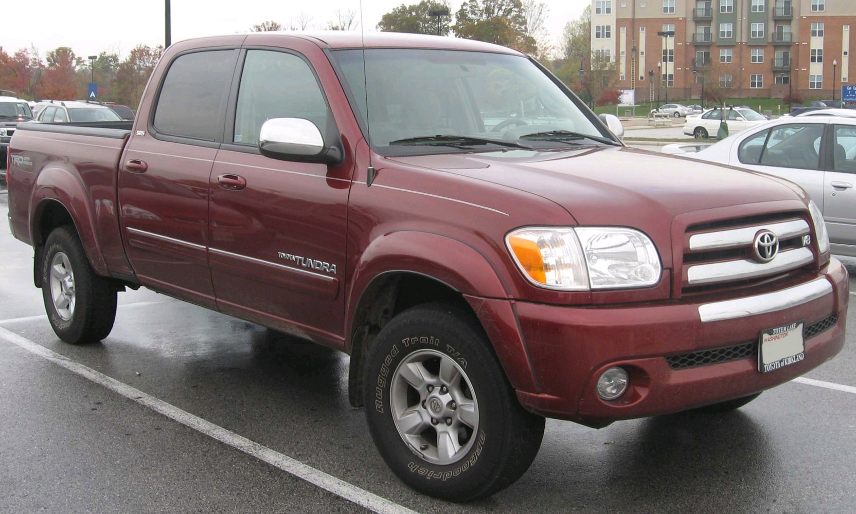 Front and side view of a rugged double cab pickup with chrome grille