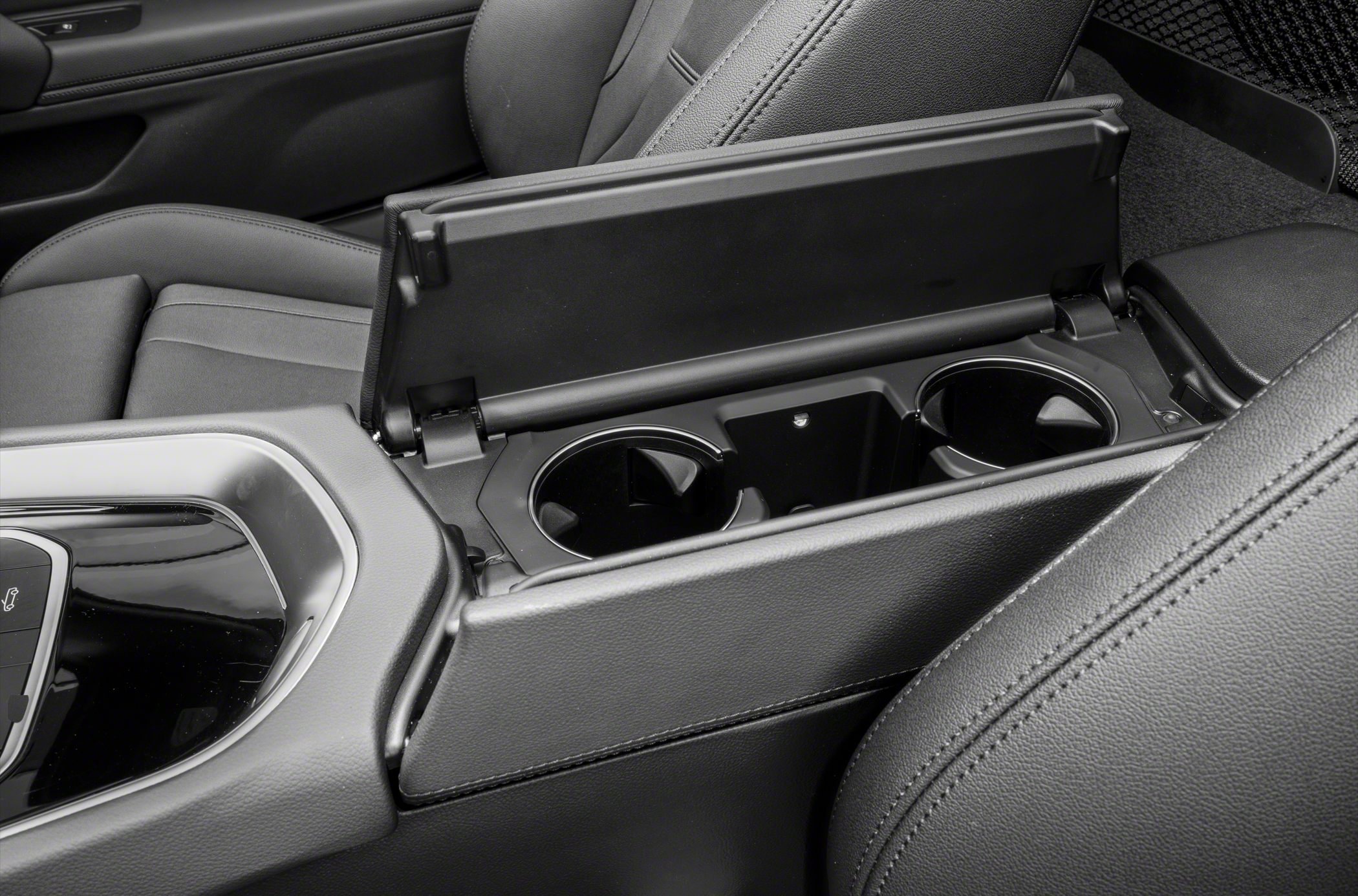 Center console with dual cup holders and premium black leather seats