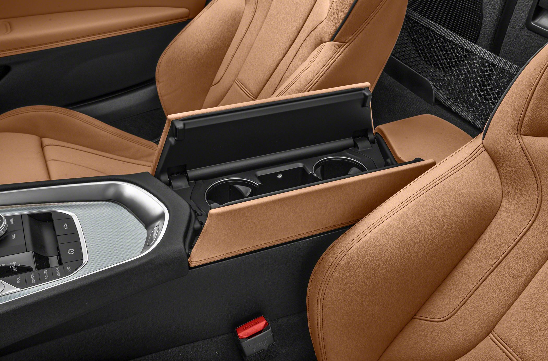 Interior with tan leather seats and open cup holder console