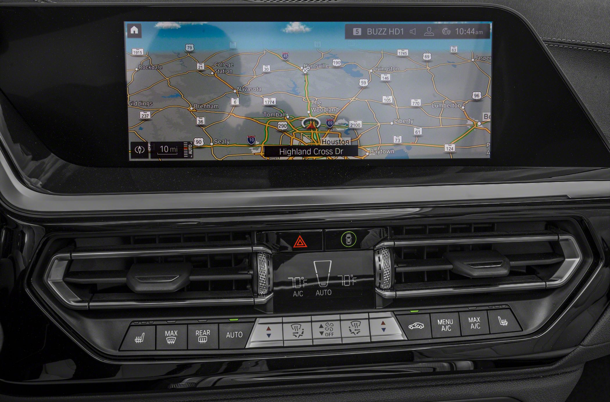 Digital climate control panel and navigation screen in a car dashboard