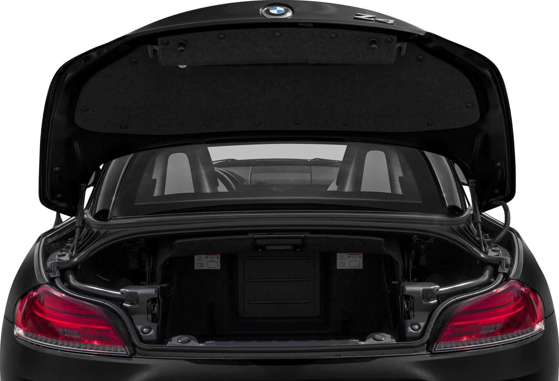 Open trunk view of convertible hardtop with visible taillights and rear seats
