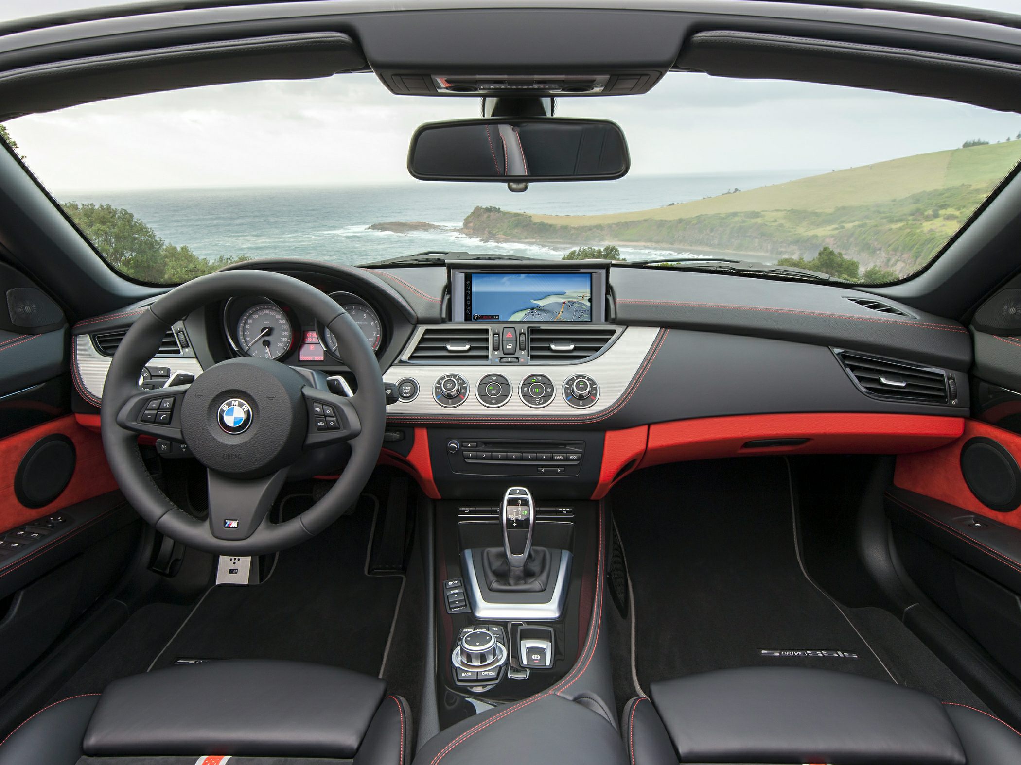 Modern BMW dashboard with digital navigation and multifunction steering wheel