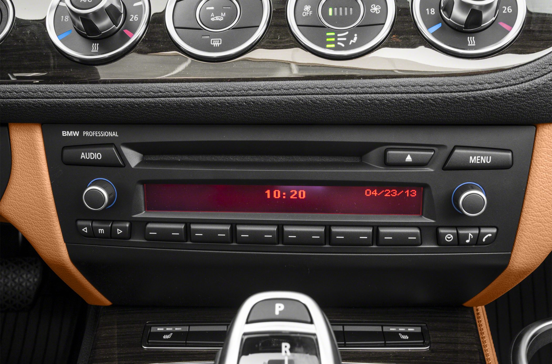Dashboard with audio system, climate control dials, and gear shifter