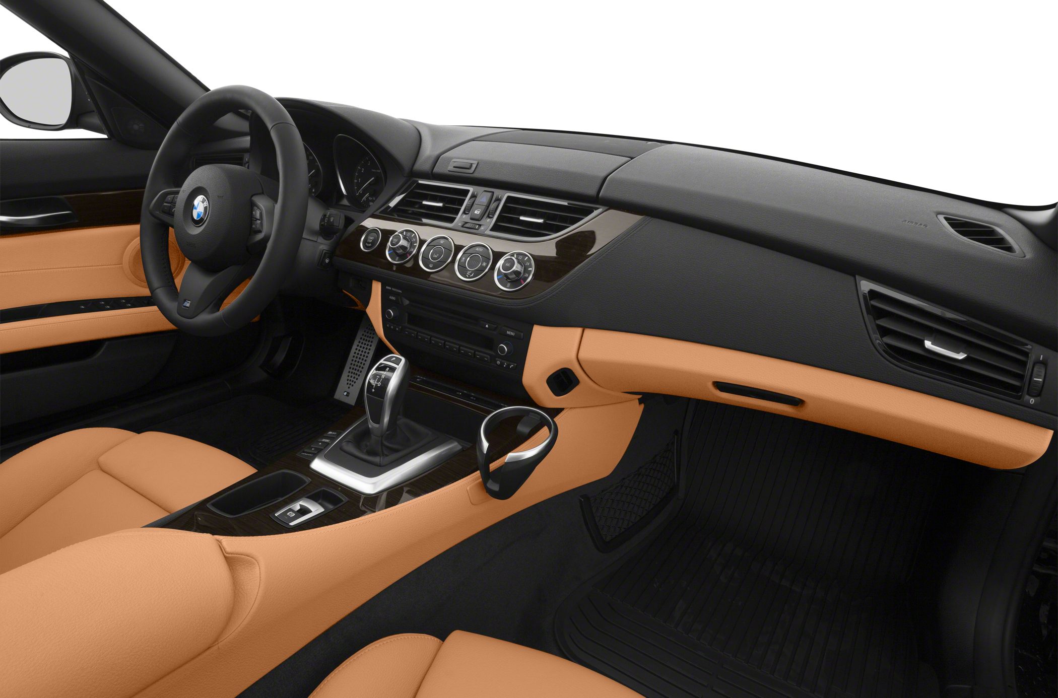 Luxury car interior with leather seats, dashboard, and automatic gear shifter.