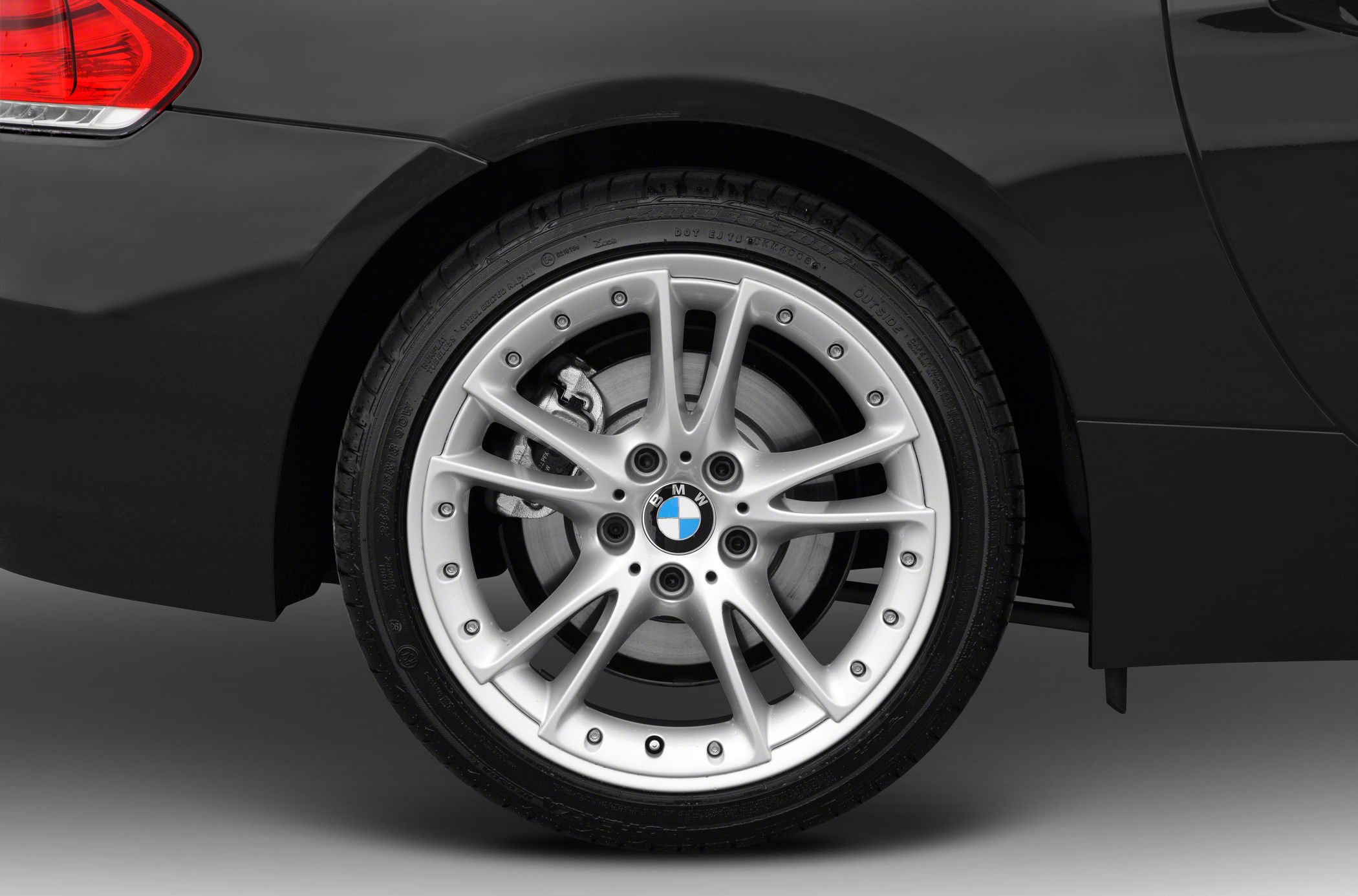 Close-up of sporty alloy wheel and tire on a rear wheel arch