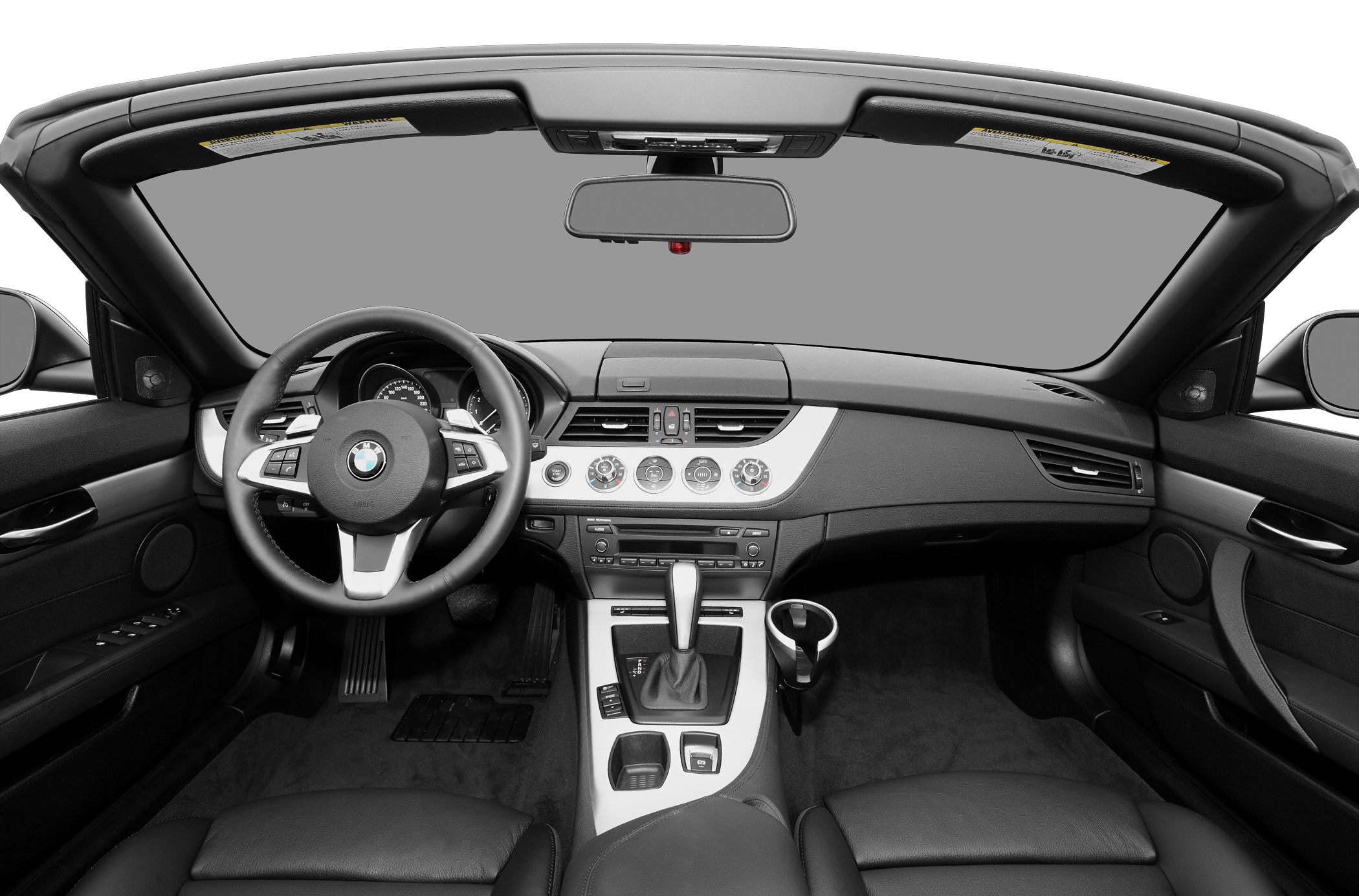 Convertible car interior with dashboard, steering wheel, and center console