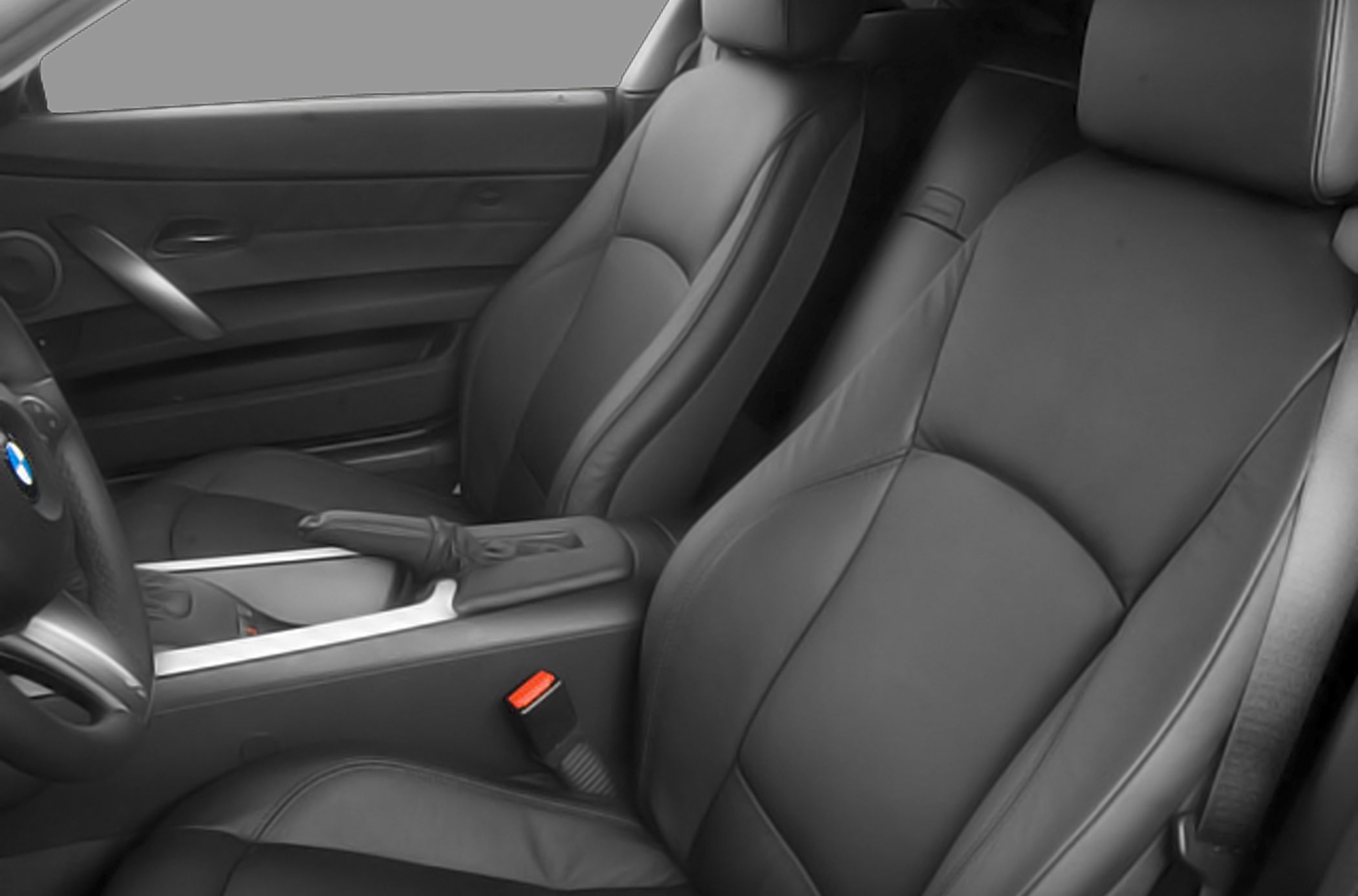 Black leather front seats and center console with seatbelt buckle