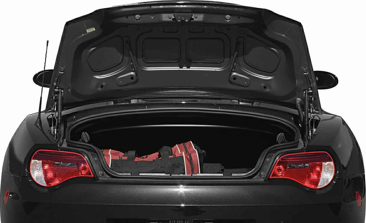 Open trunk with red bag and rear tail lights.