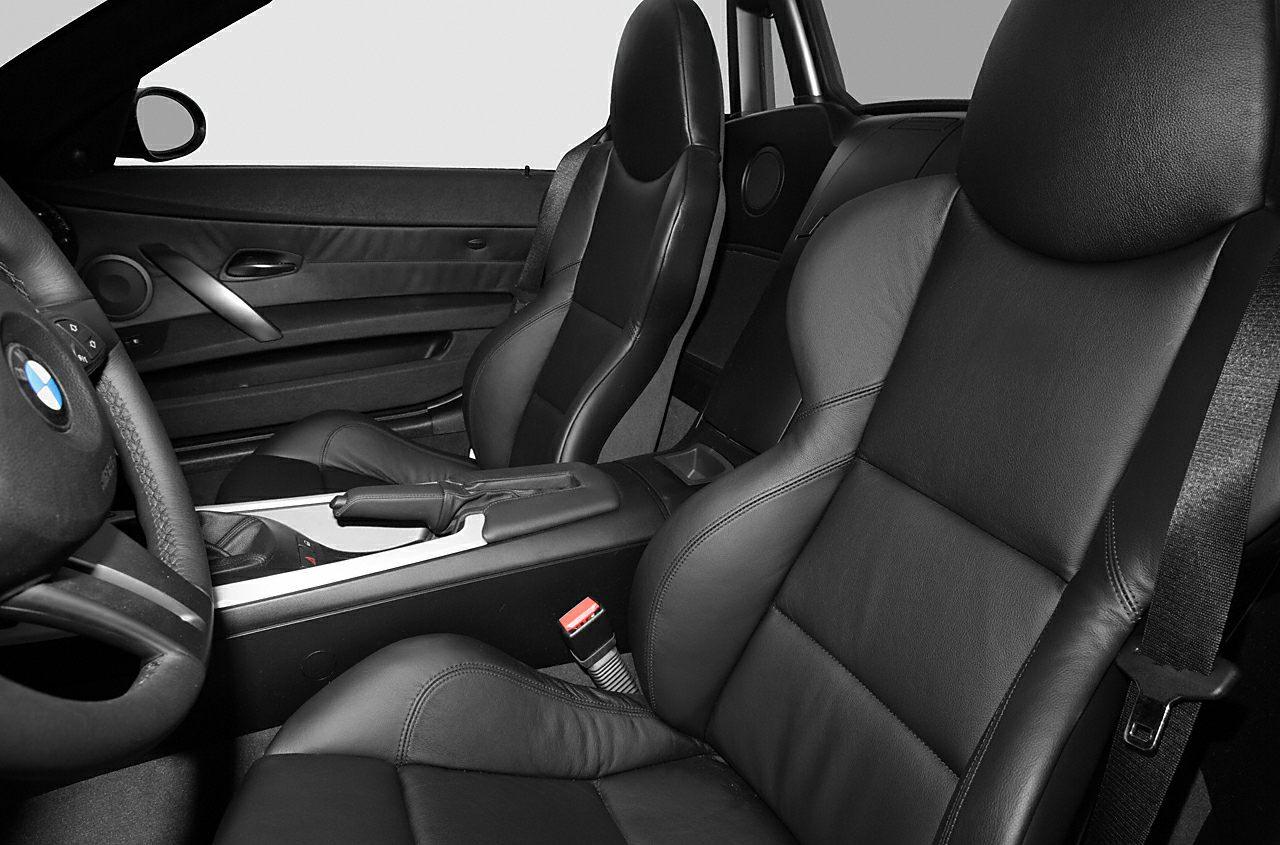 Black leather seats with door panel and center console interior features