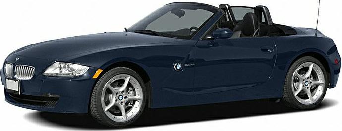 Dark blue convertible roadster with 5-spoke alloy wheels and soft-top roof
