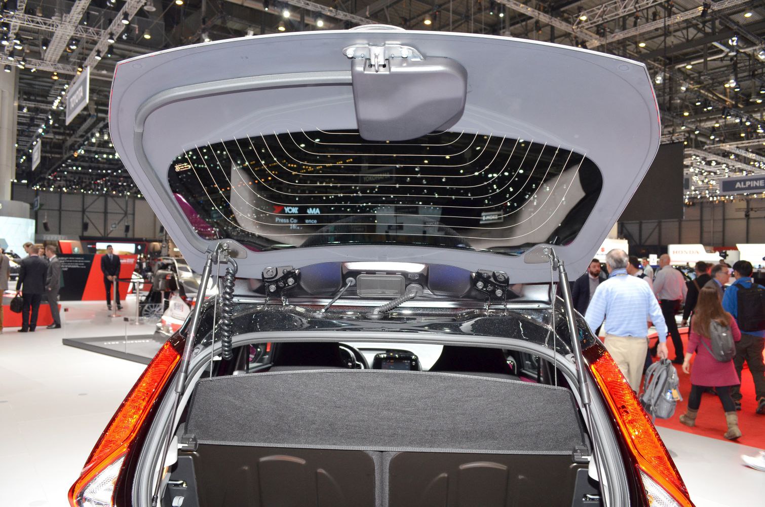 Open rear hatch with trunk space and rear window of a hatchback.