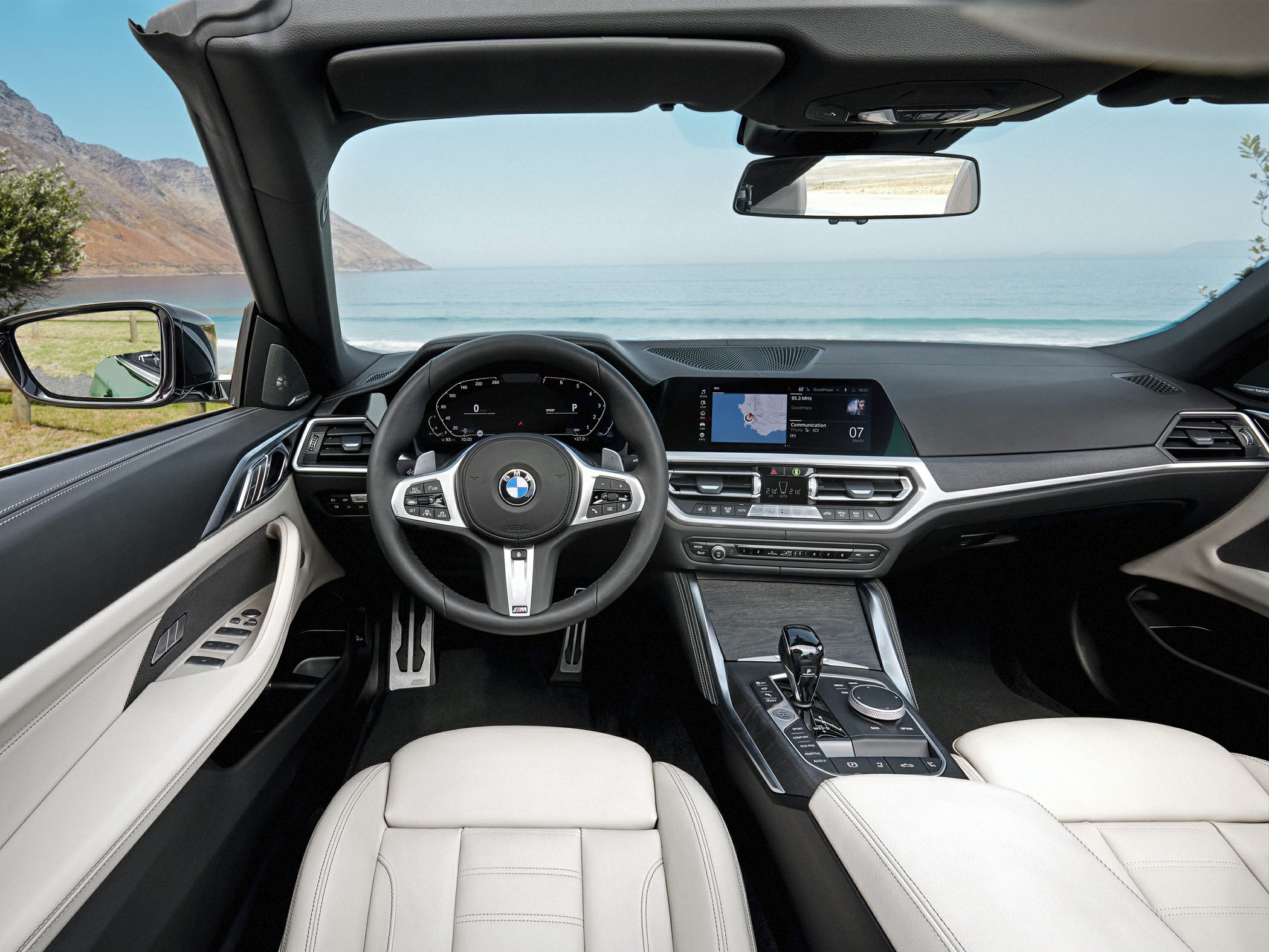 Digital dashboard and center console with steering wheel in luxury convertible interior