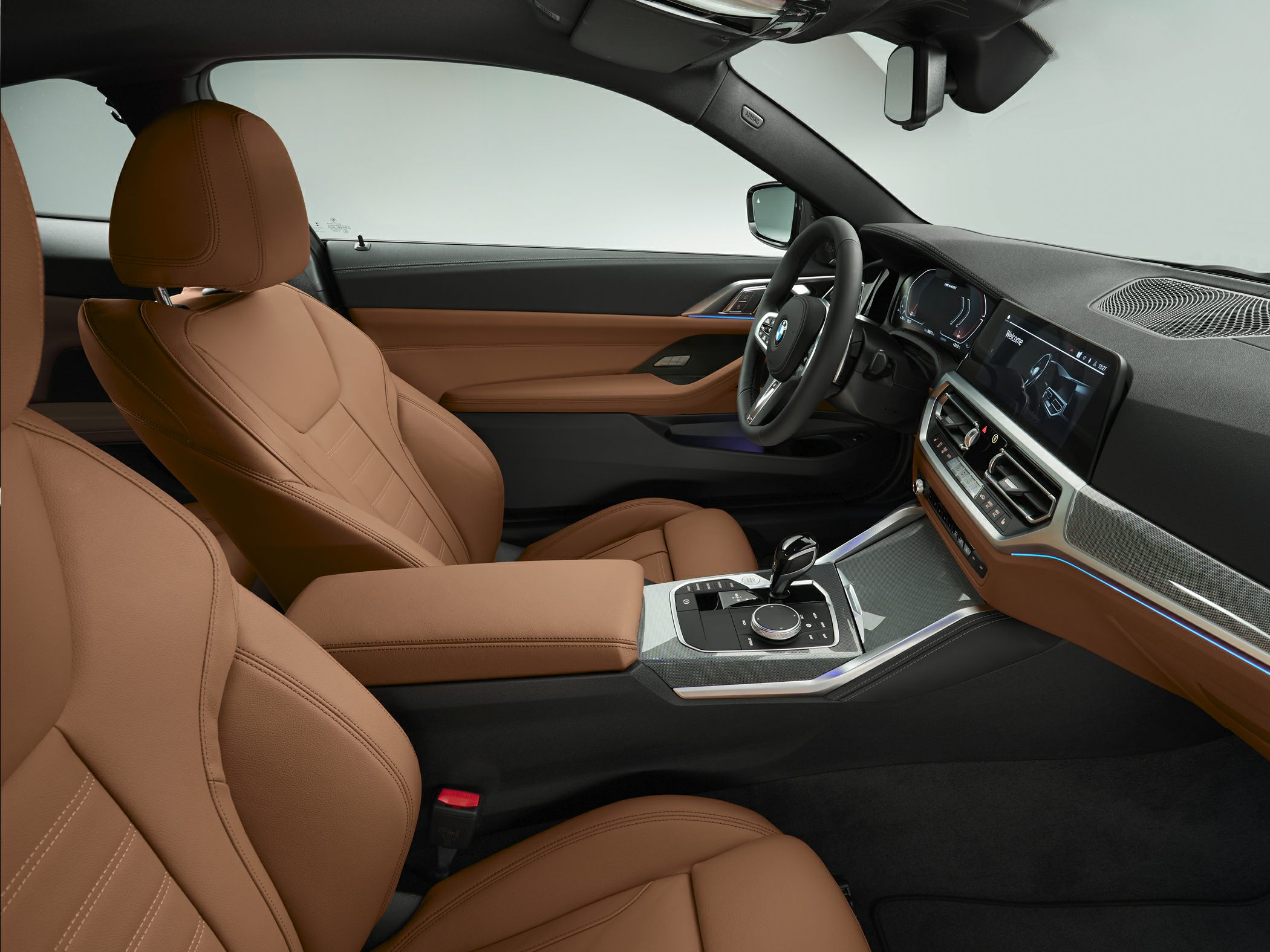 Brown leather seats and modern dashboard with infotainment system