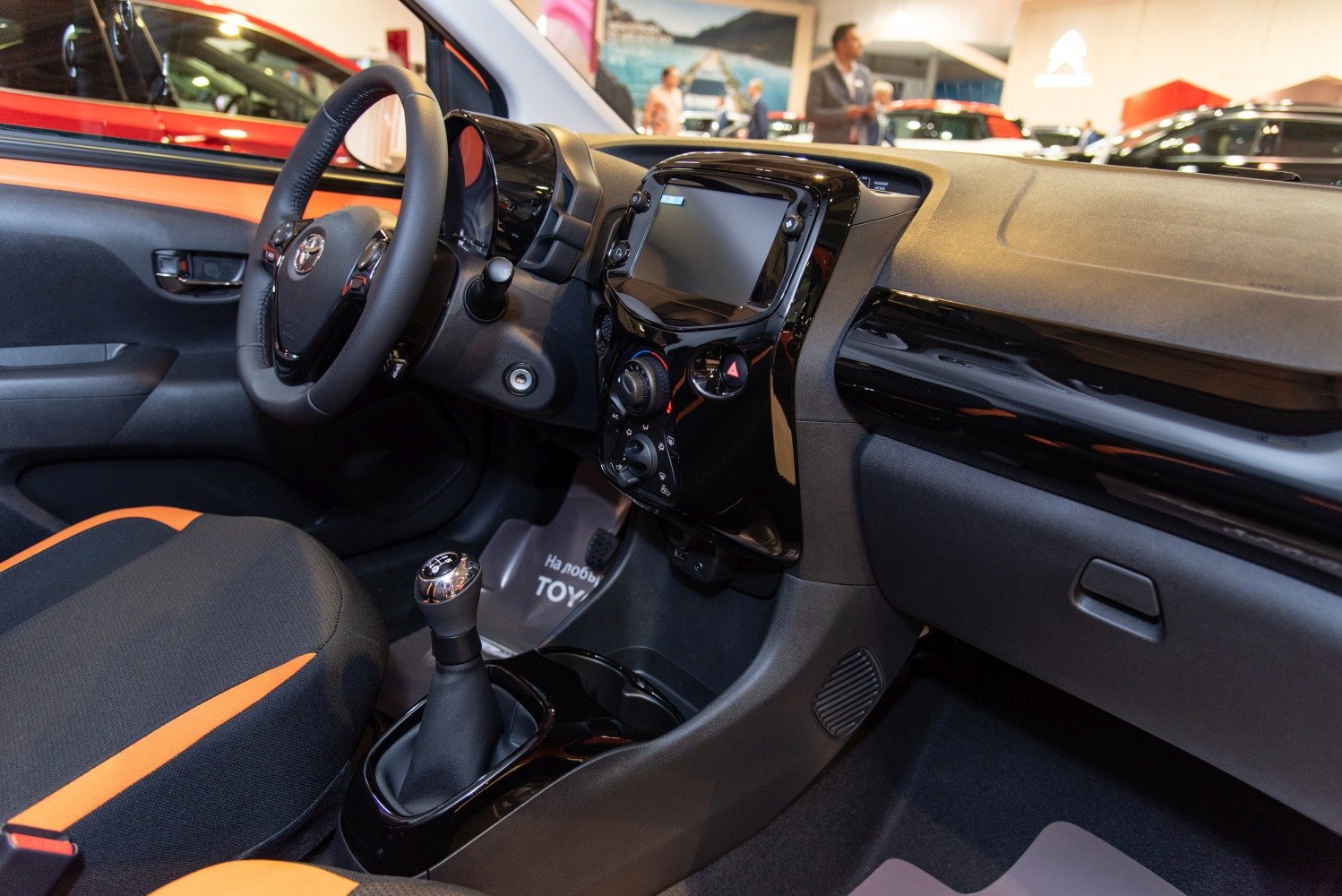 Car interior with manual gear shift and touchscreen