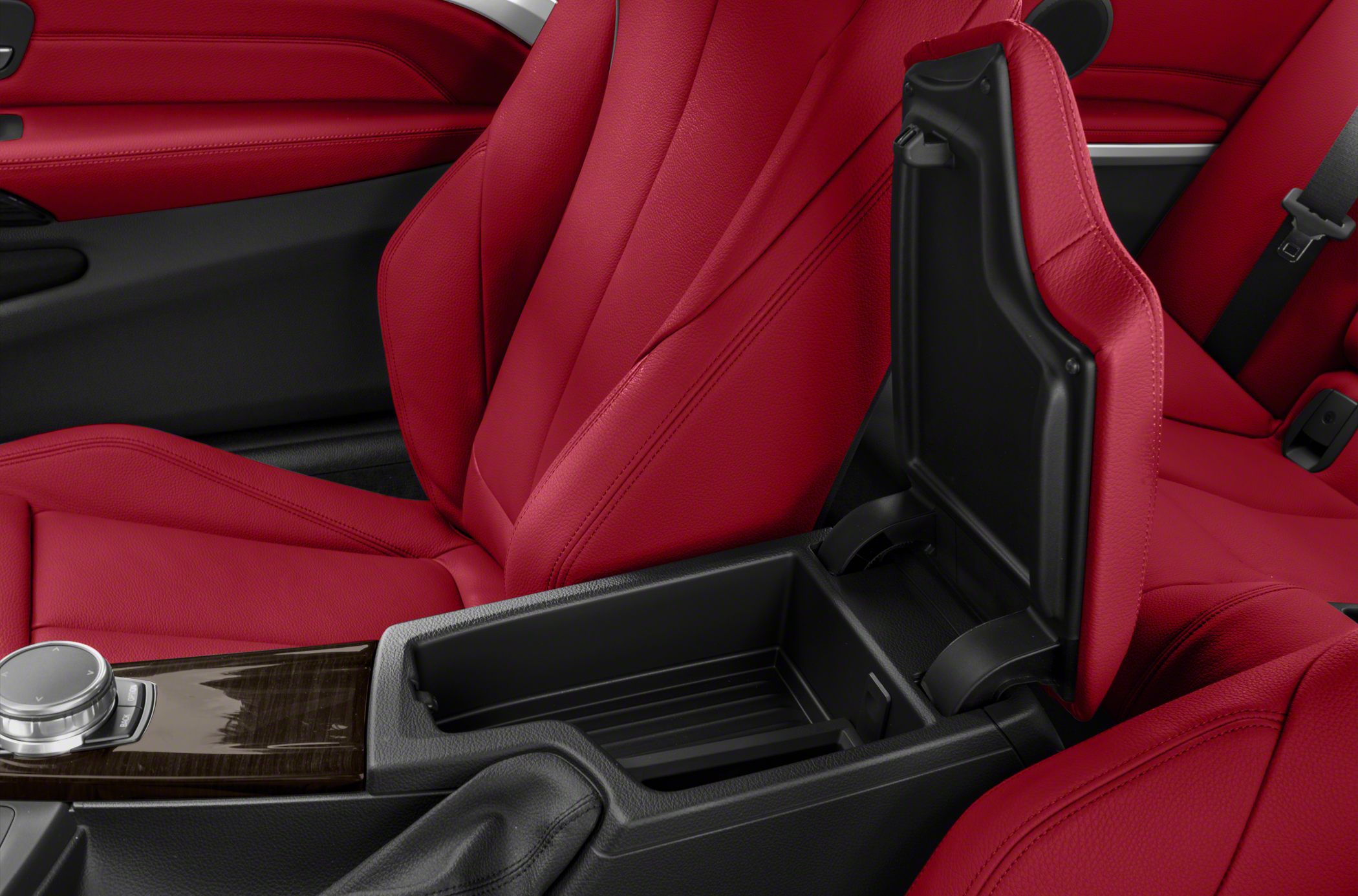 Red leather seats and open center console storage compartment
