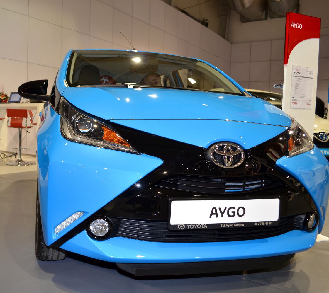 Front view with distinctive X-shaped grille and headlights