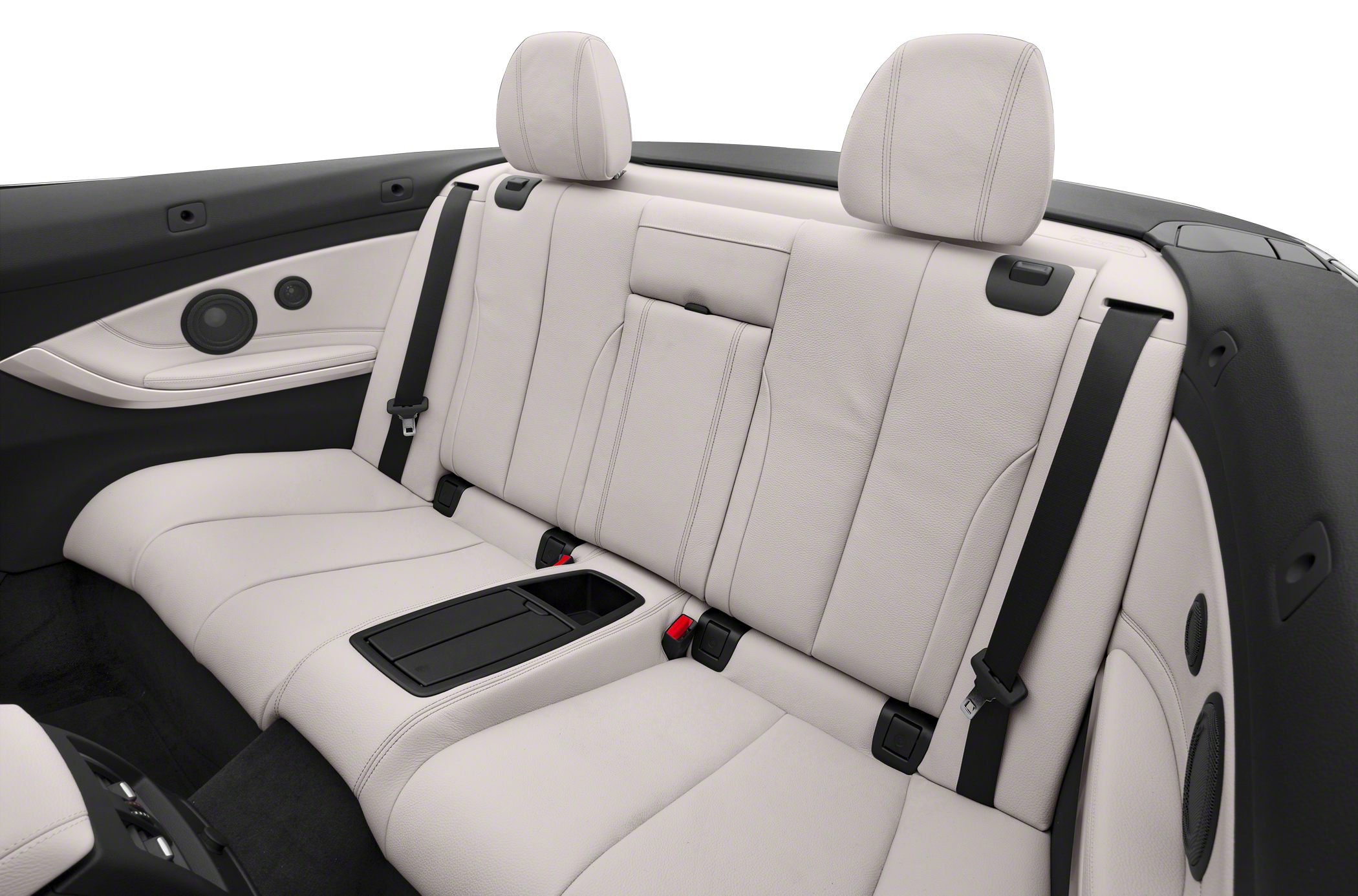 Beige leather rear seats with integrated speakers and seat belts