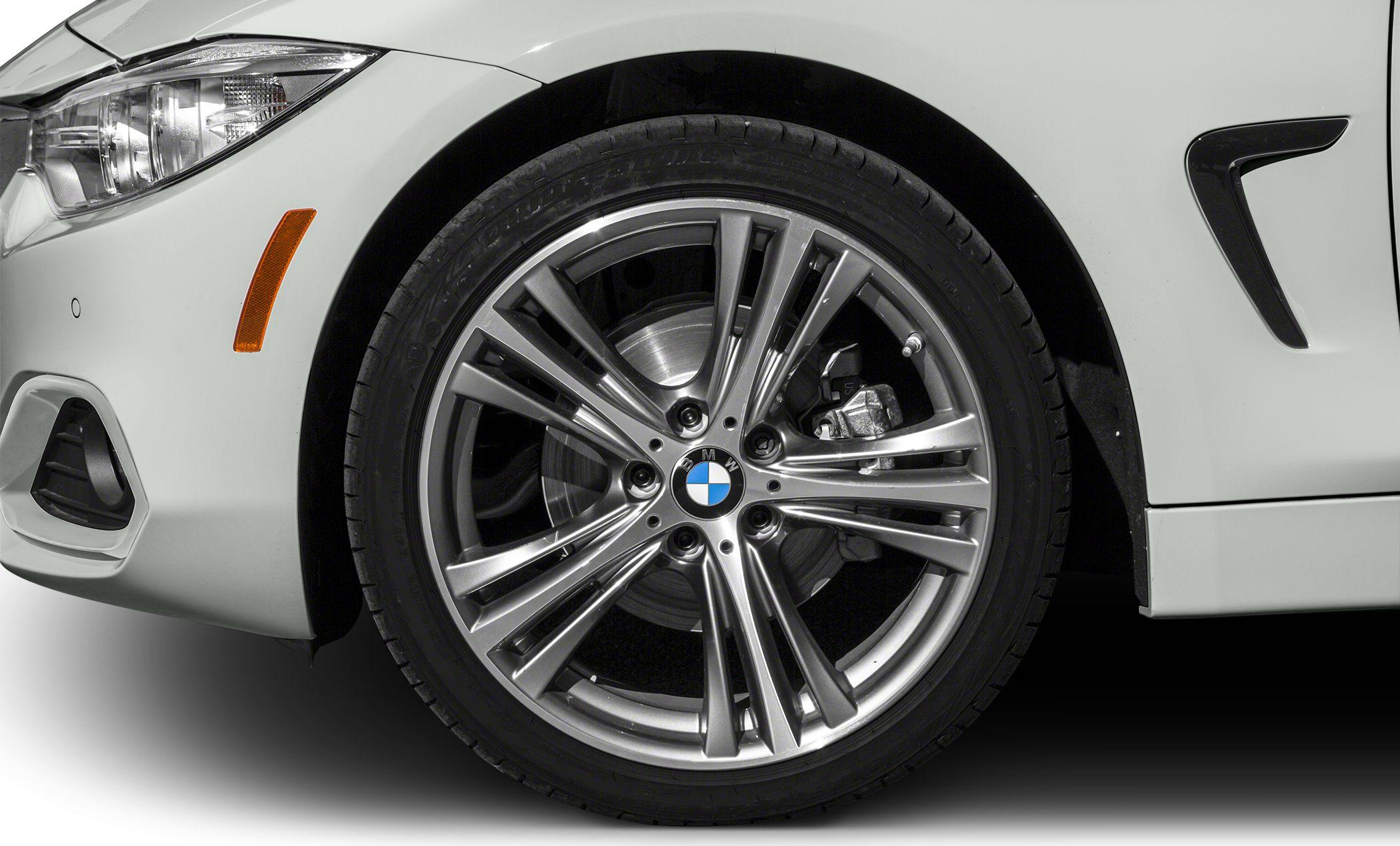 Close-up of alloy wheel and front fender with brake caliper detail
