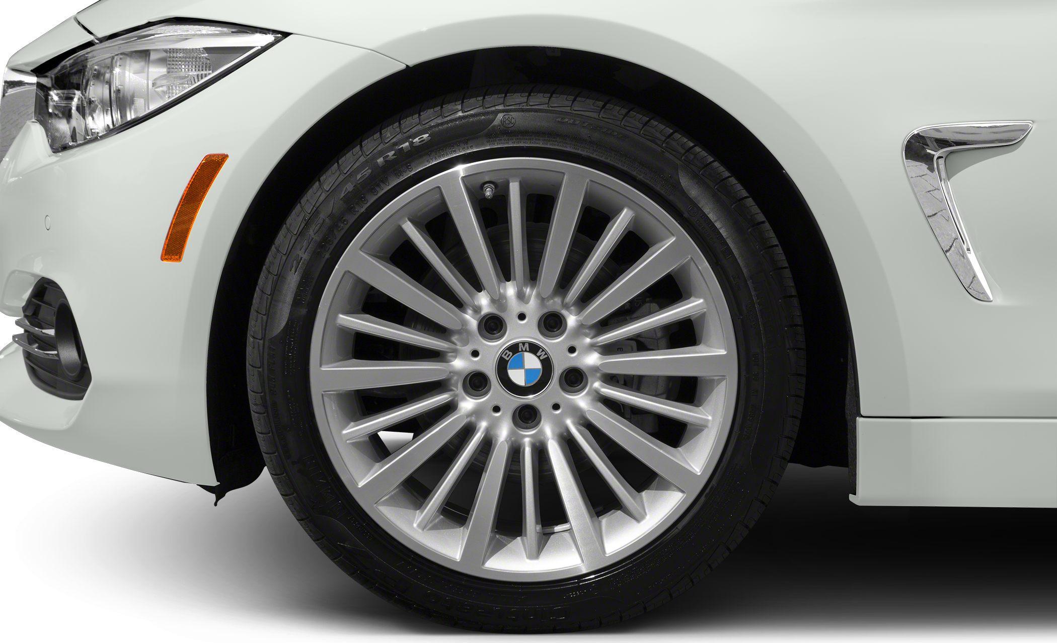 Alloy wheel, tire, front headlight, and fender vent close-up