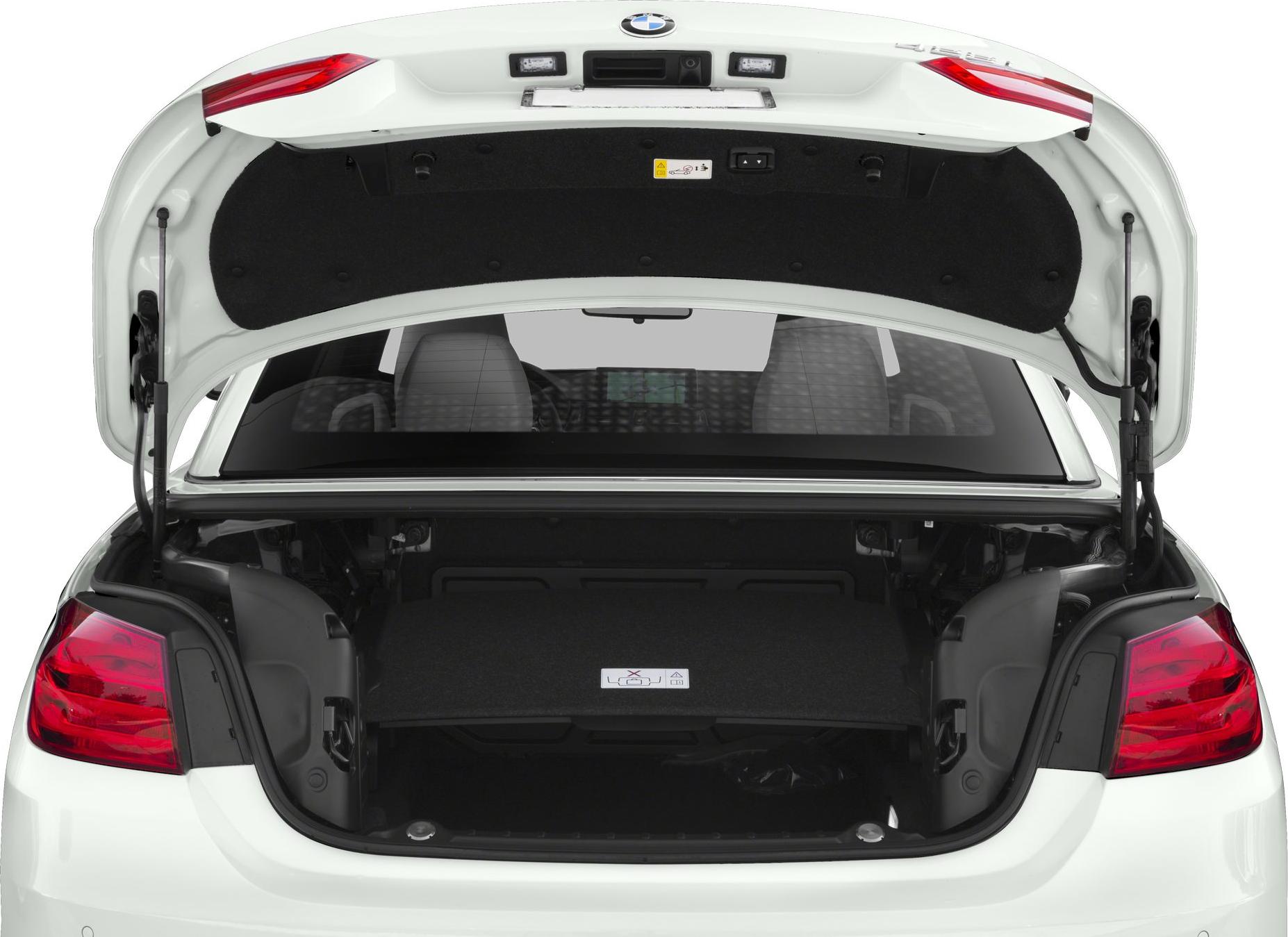 Open trunk space of a BMW convertible with visible taillights