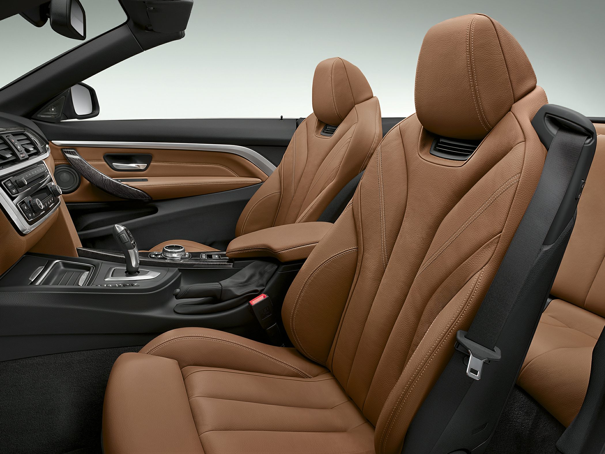 Luxury brown leather seats and modern dashboard with gear shifter