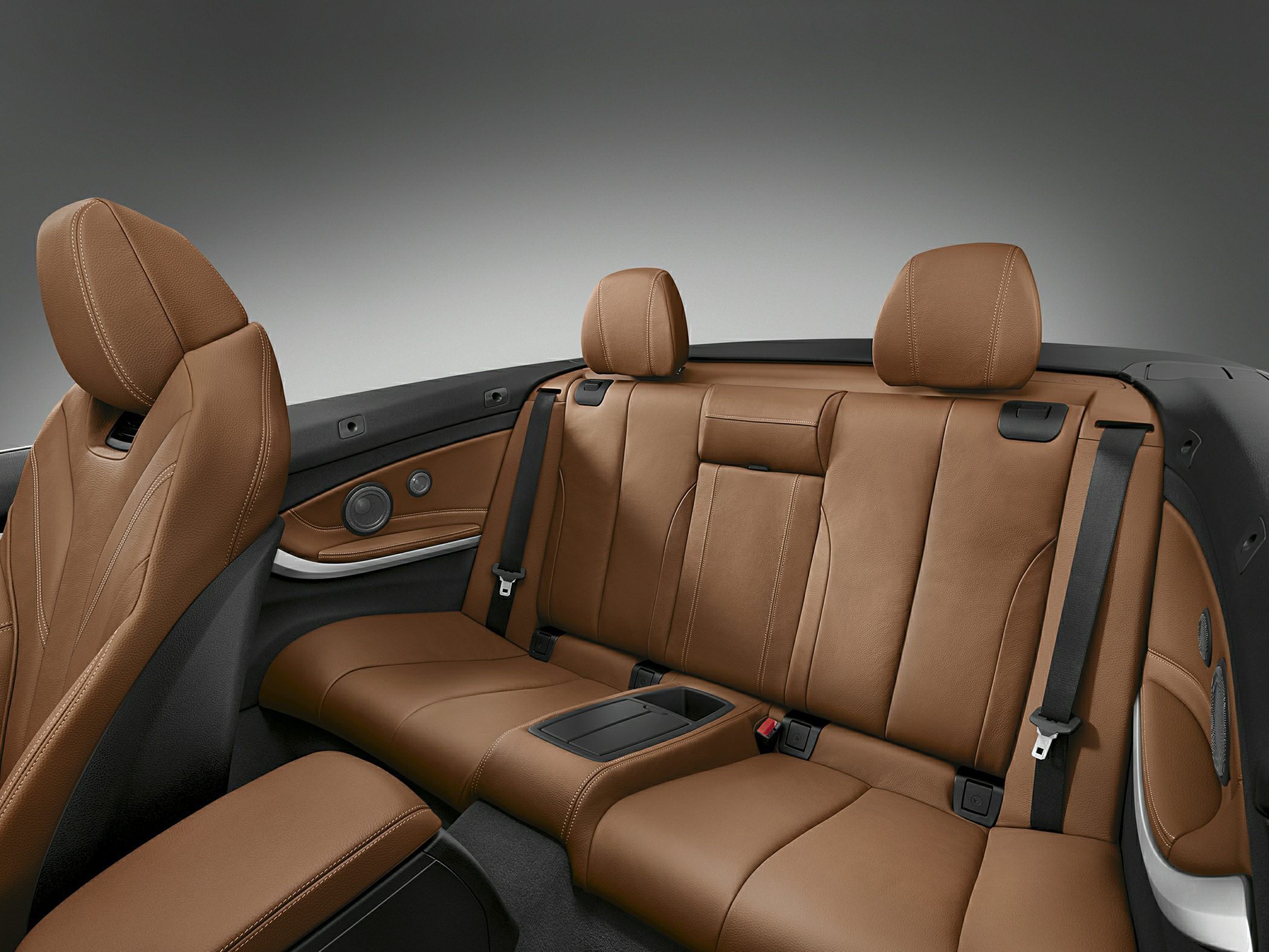 Brown leather rear seats with premium detailing and integrated seatbelts