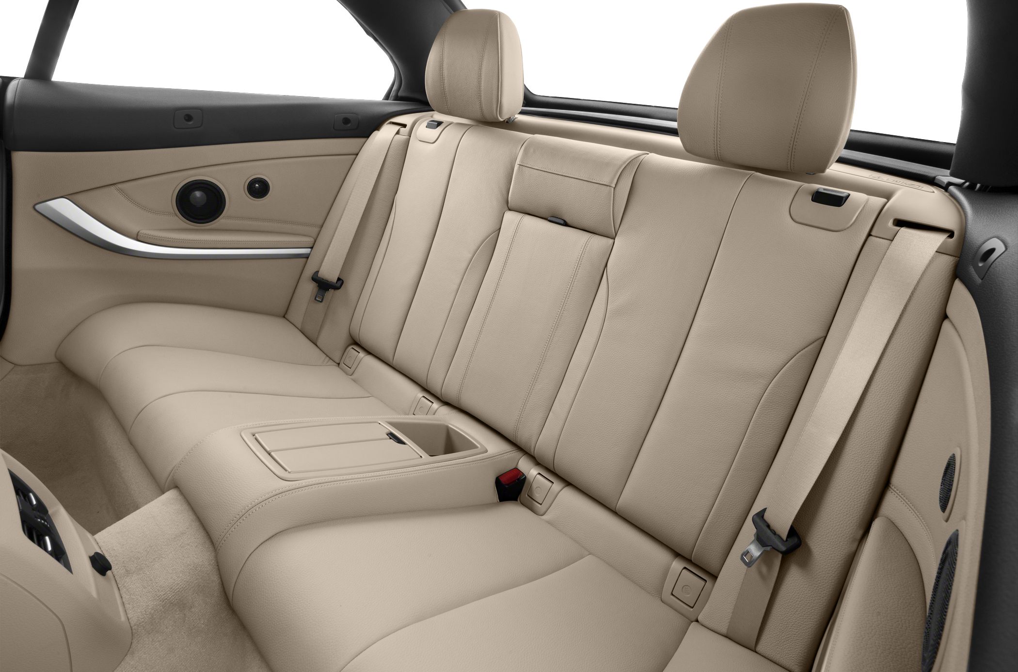 Beige leather rear seats with armrest, seat belts, and speakers