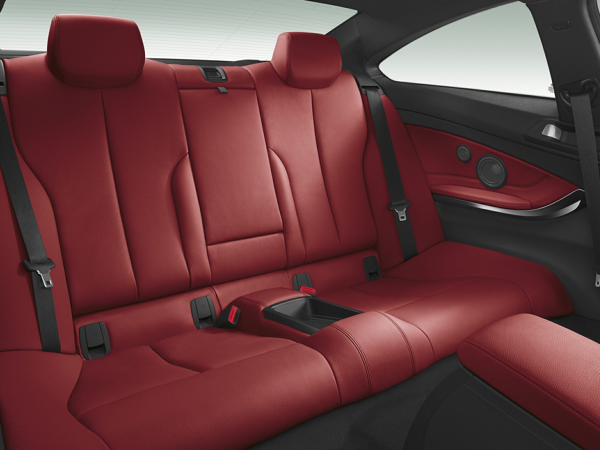 Red leather rear seat with armrest and integrated speakers