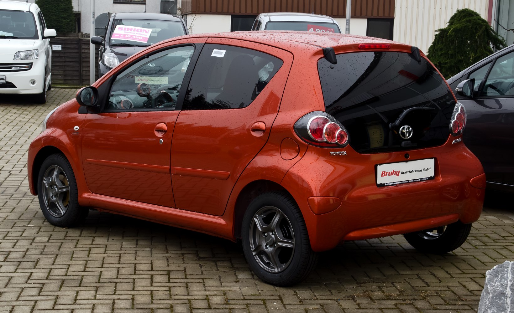 Compact hatchback with rounded rear lights and alloy wheels