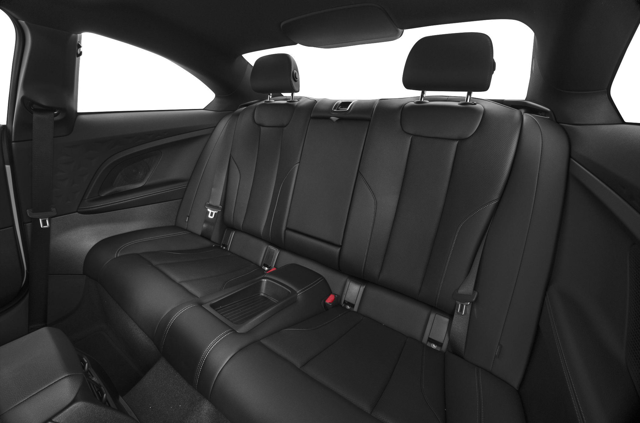 Spacious rear seat area with black leather upholstery and headrests