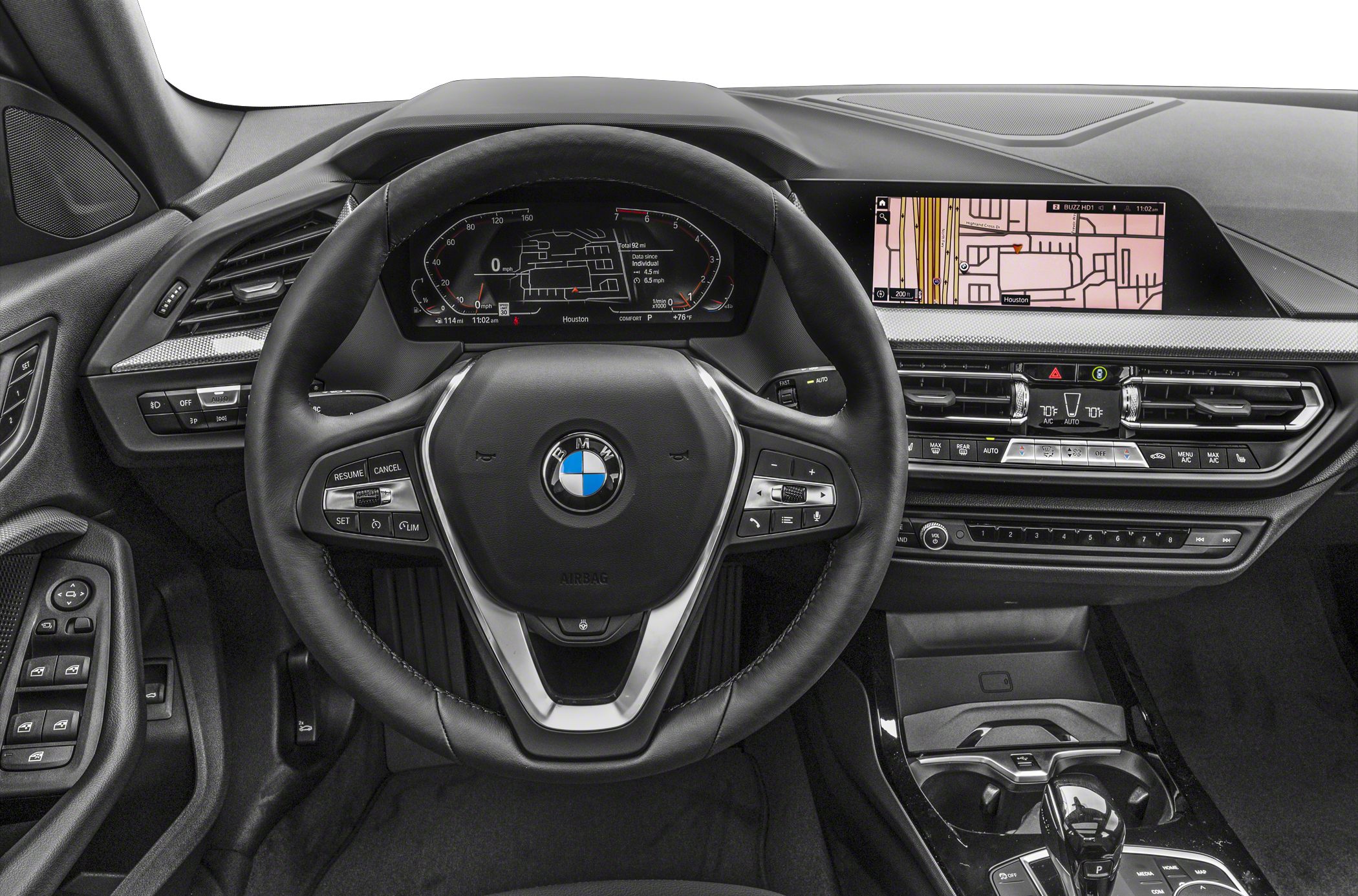 Digital dashboard, steering wheel with controls, wide infotainment screen, and center console