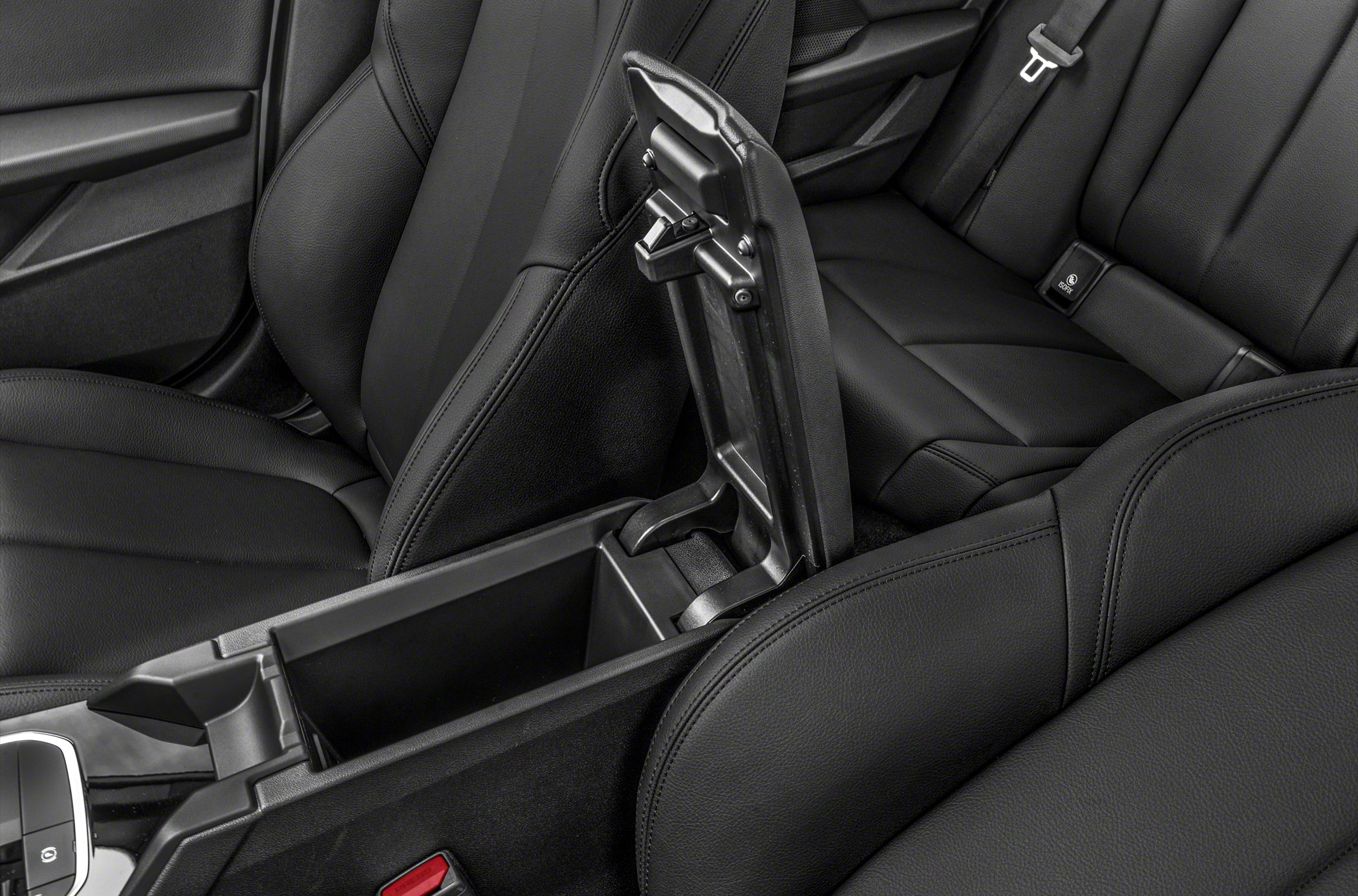 Open center console storage with black leather seats
