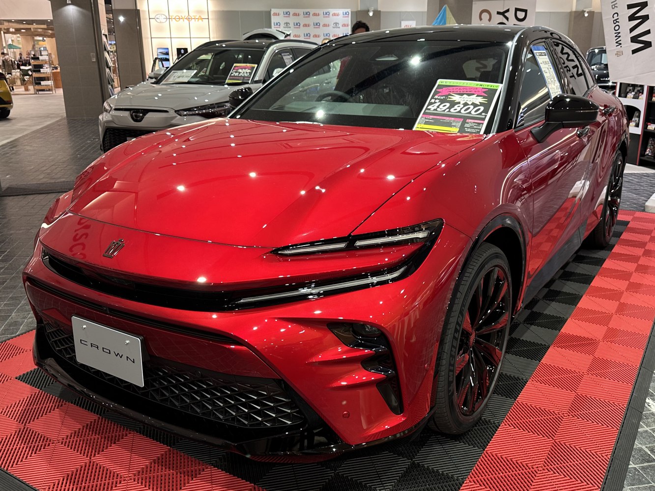 Red front view with LED headlights and black sport wheels.