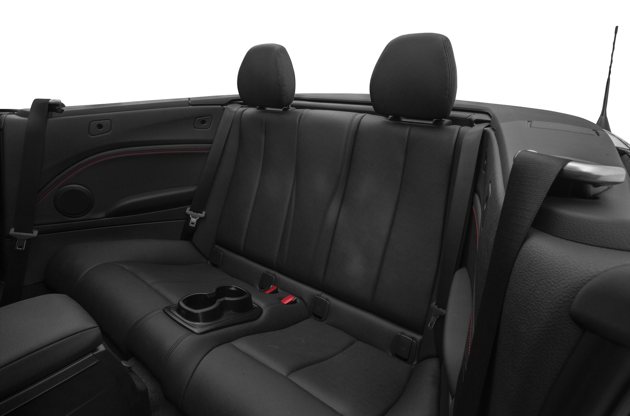 Black leather rear seats with cup holders and seat belts in a convertible
