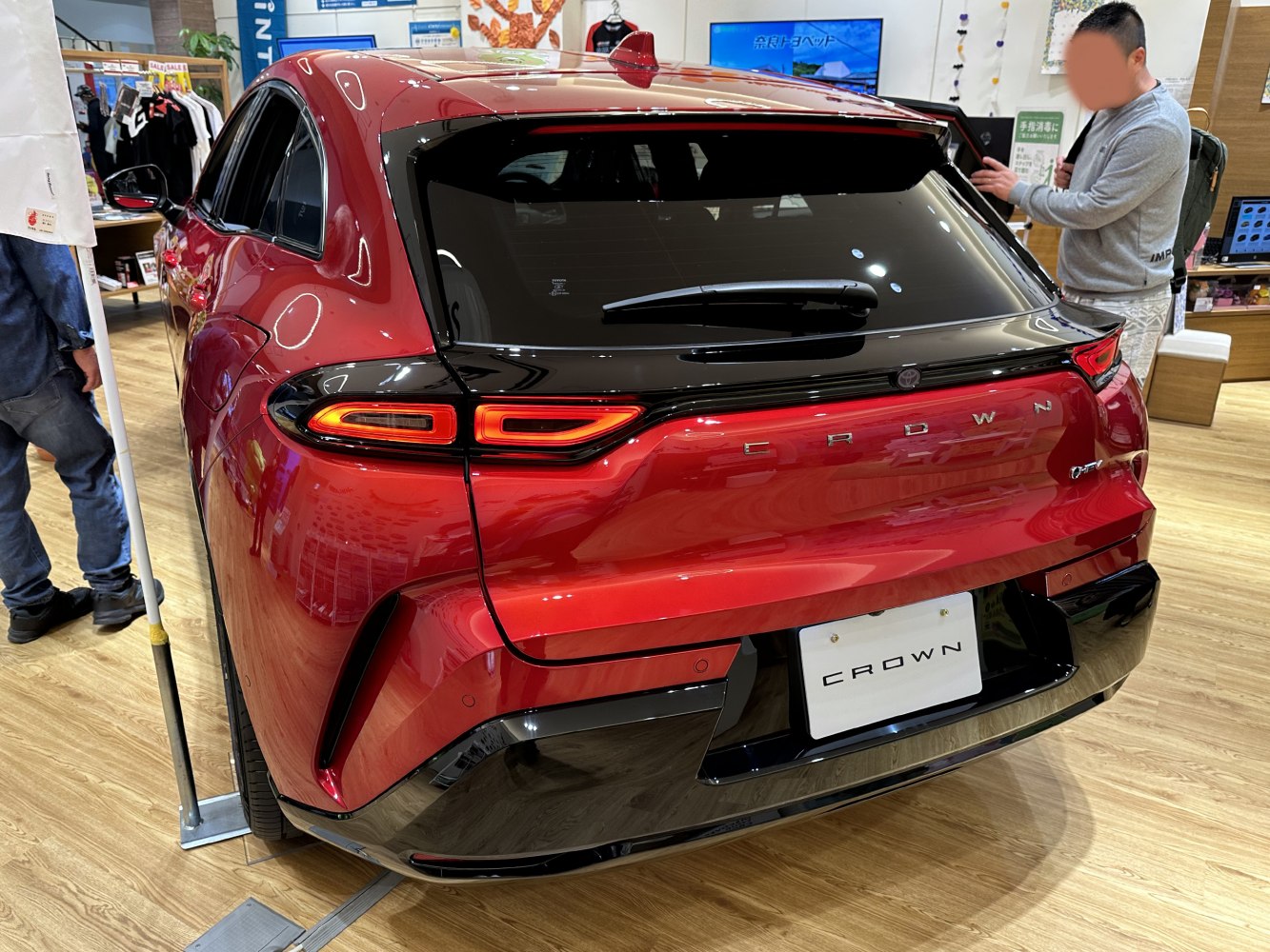 Rear view with LED taillights and hybrid badge on red sportback vehicle