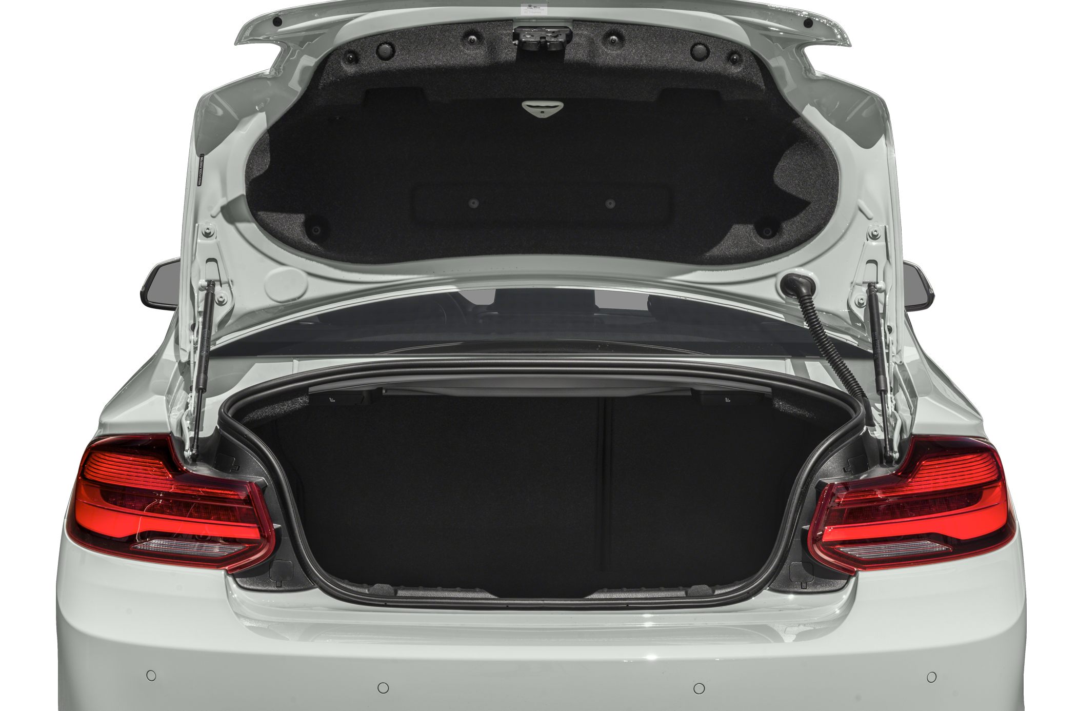 Open car trunk showing spacious cargo area and taillights