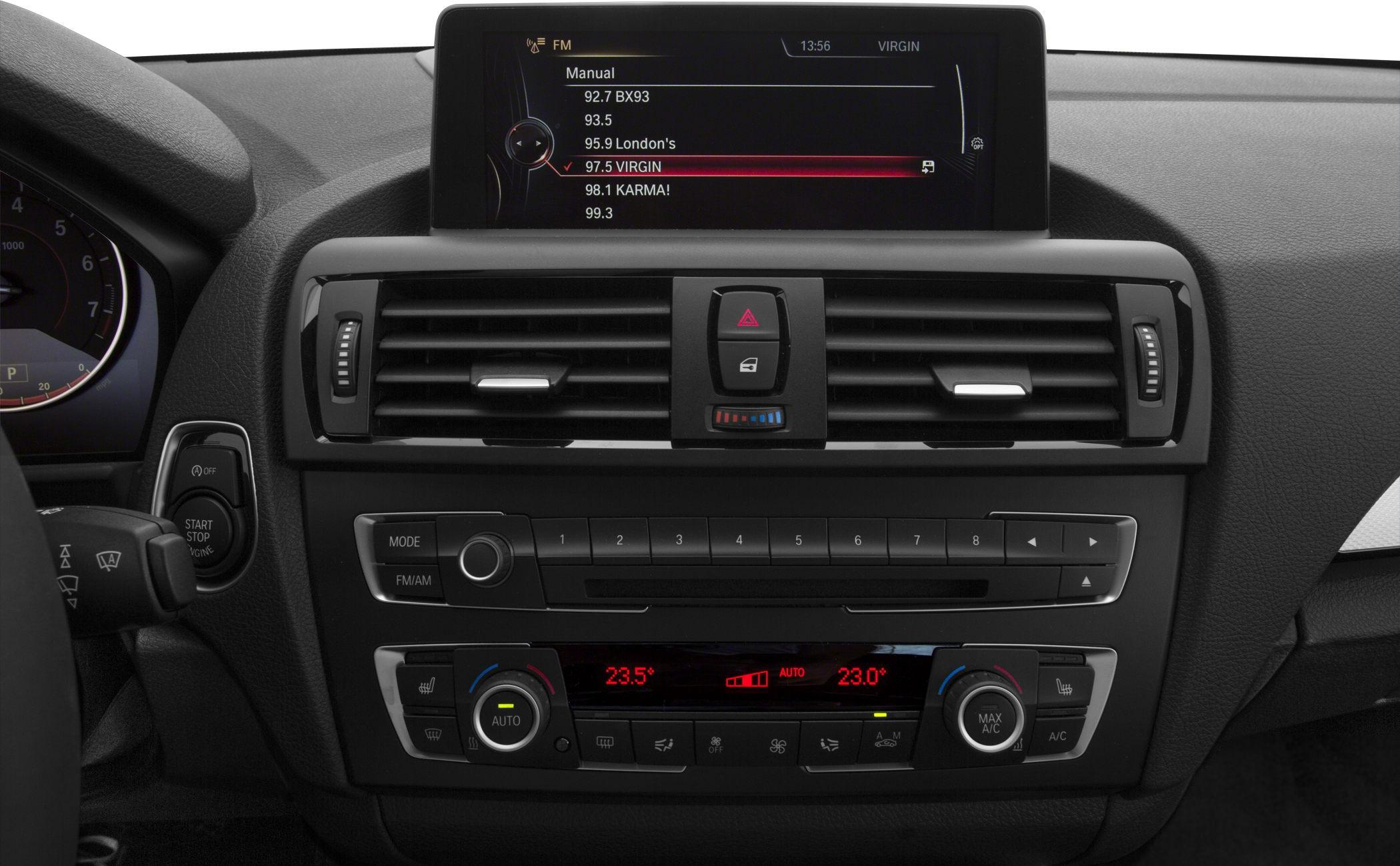 Dashboard with infotainment screen, climate control, air vents, and start/stop button