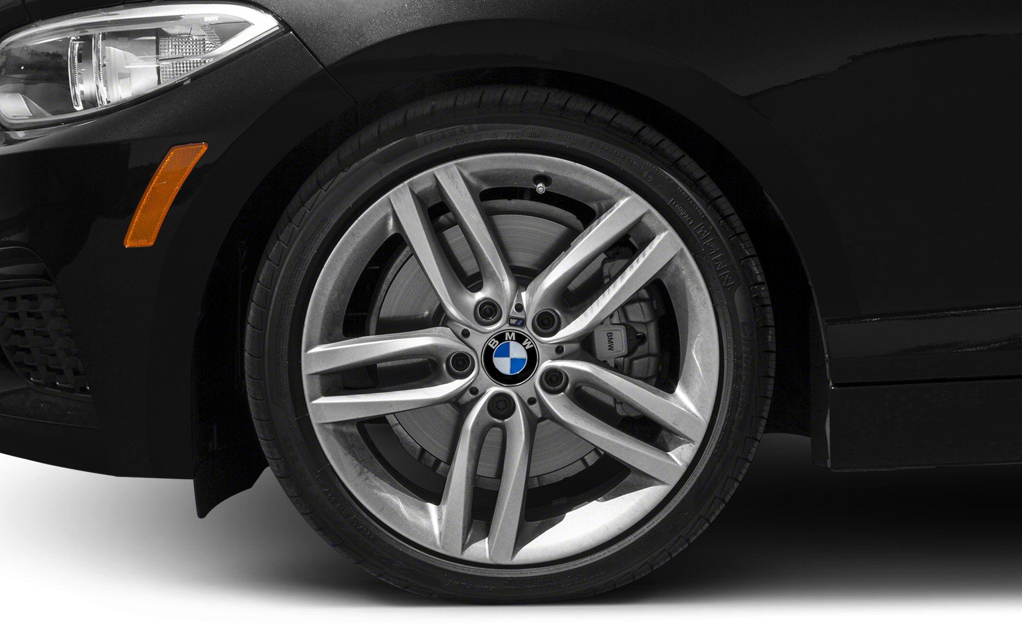 Close-up of alloy wheel with brake caliper and headlight front side detail