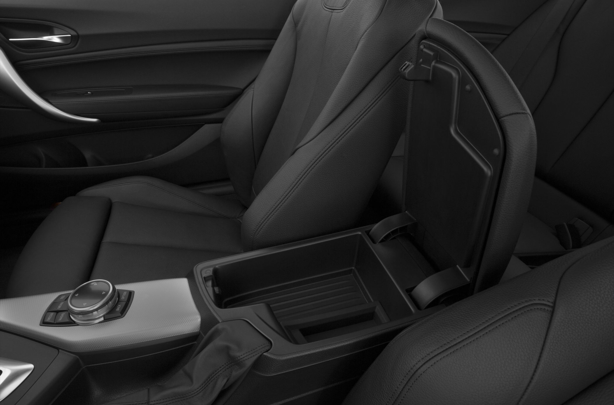 Center console storage compartment and leather seats in car interior