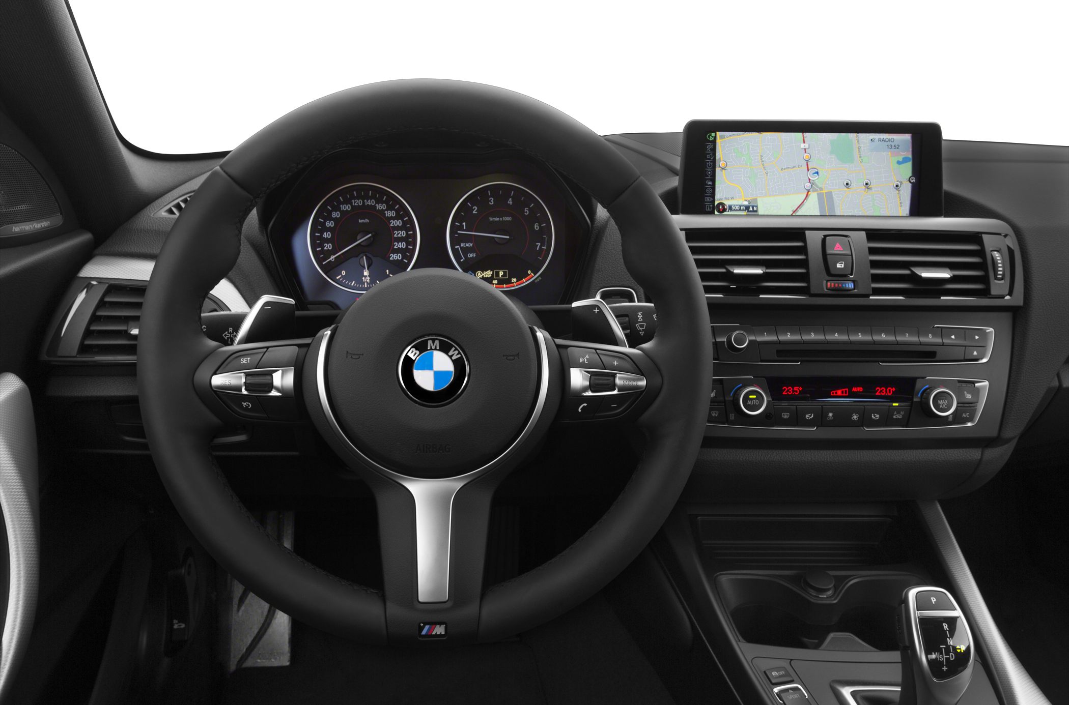 Steering wheel, digital gauges, and infotainment screen in car interior