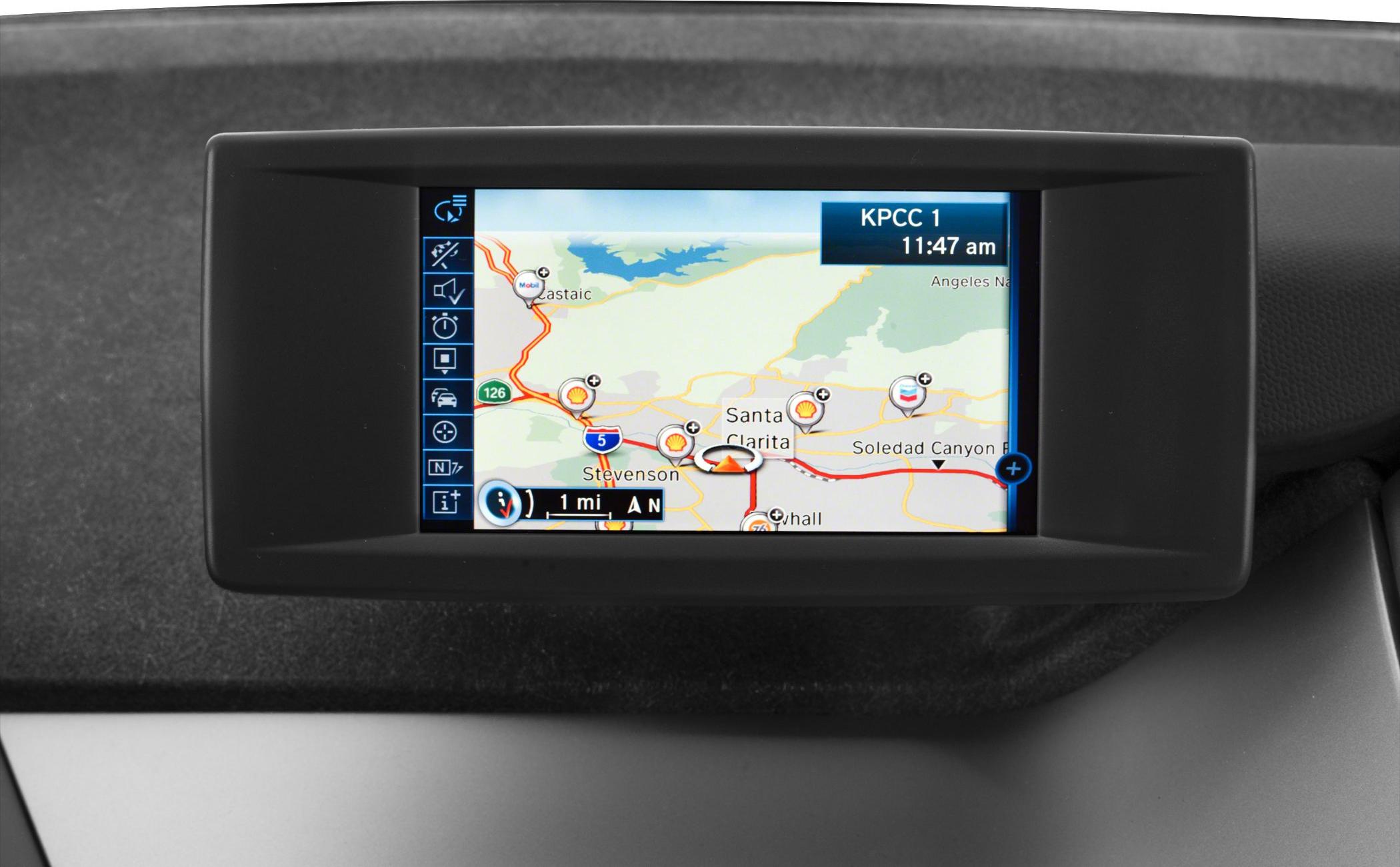 In-car navigation system screen with route map and point-of-interest icons