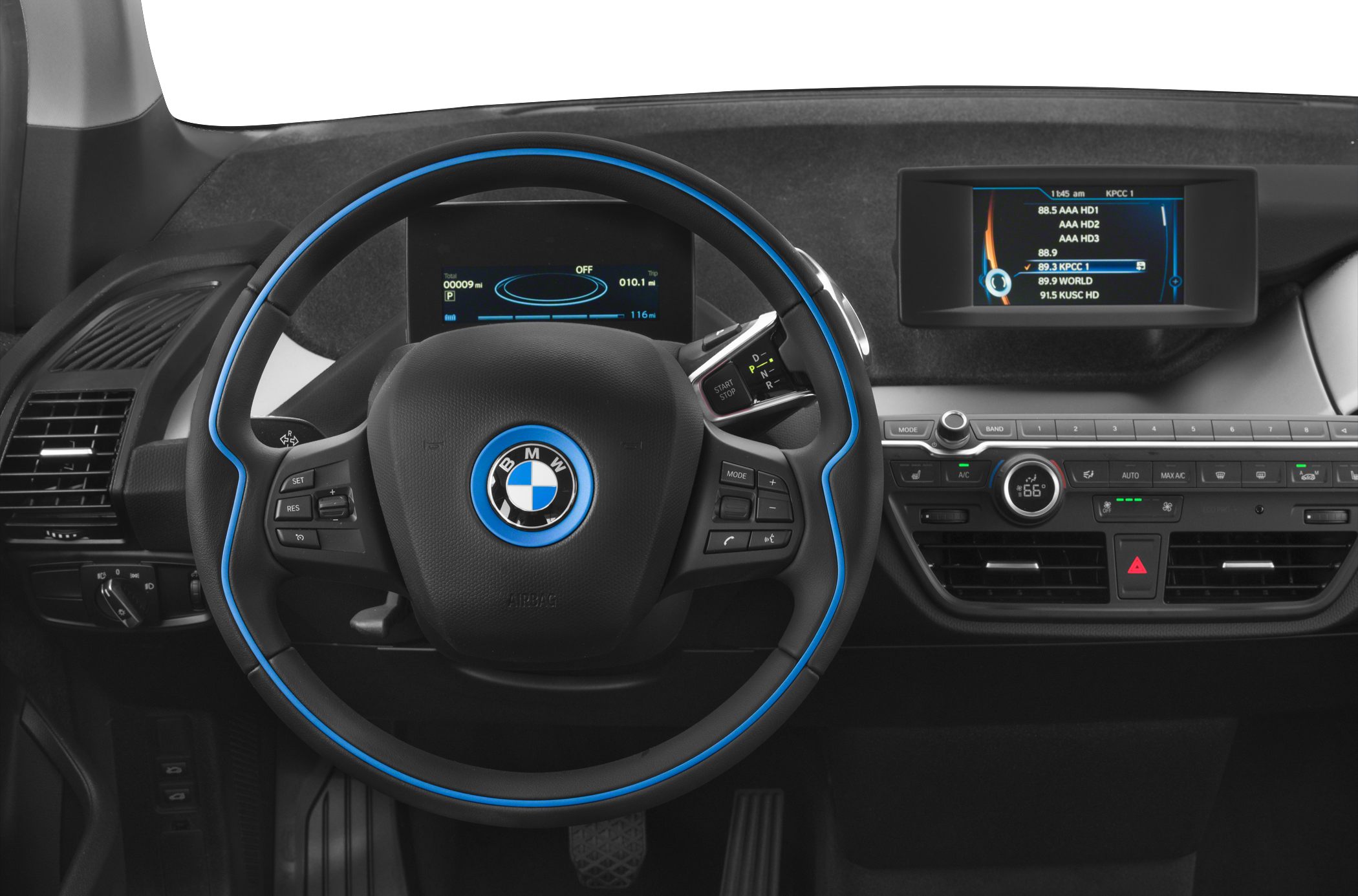Steering wheel with blue trim and digital dashboard display.