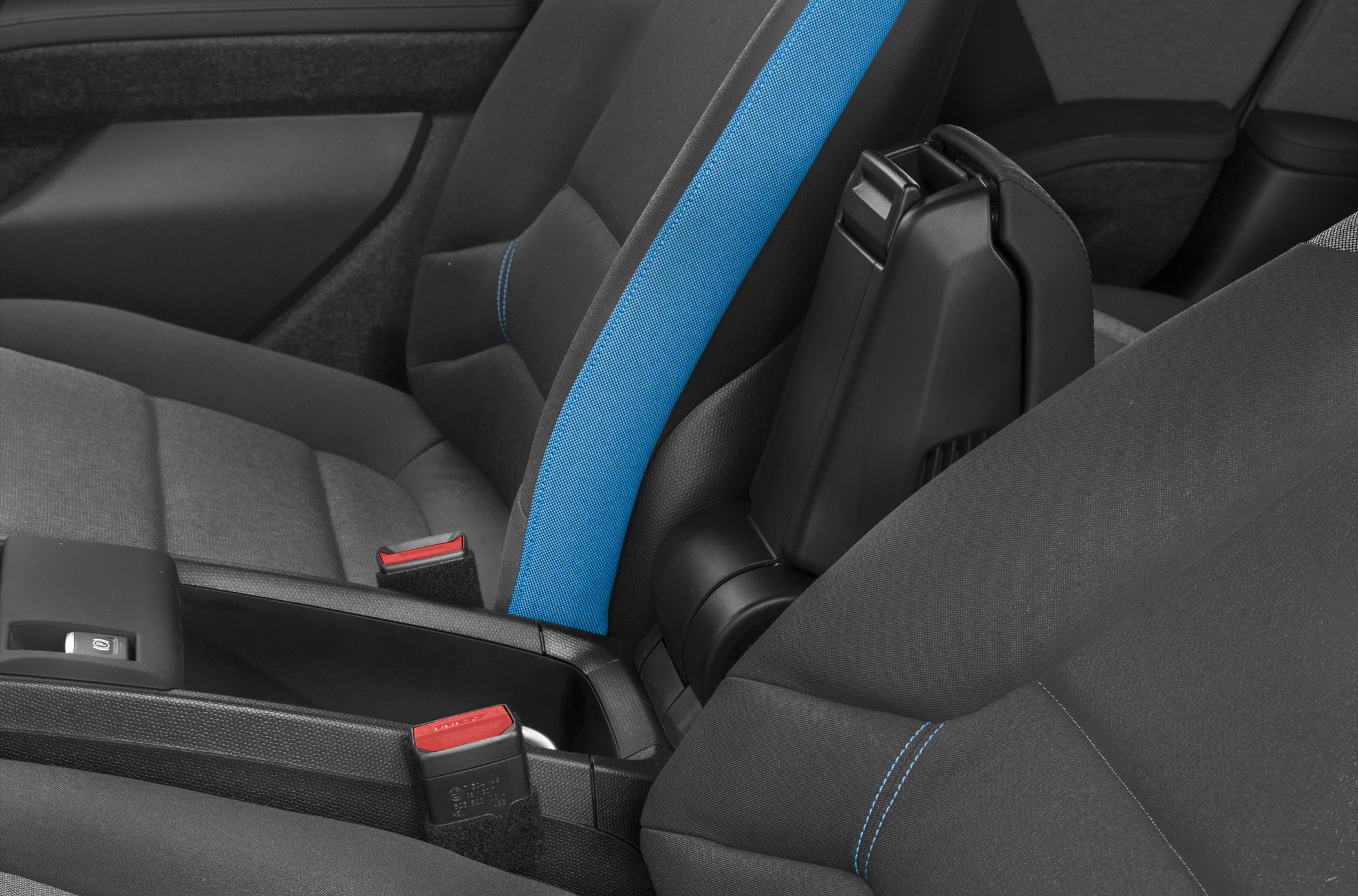 Blue accented sporty seats and center console with seat belts