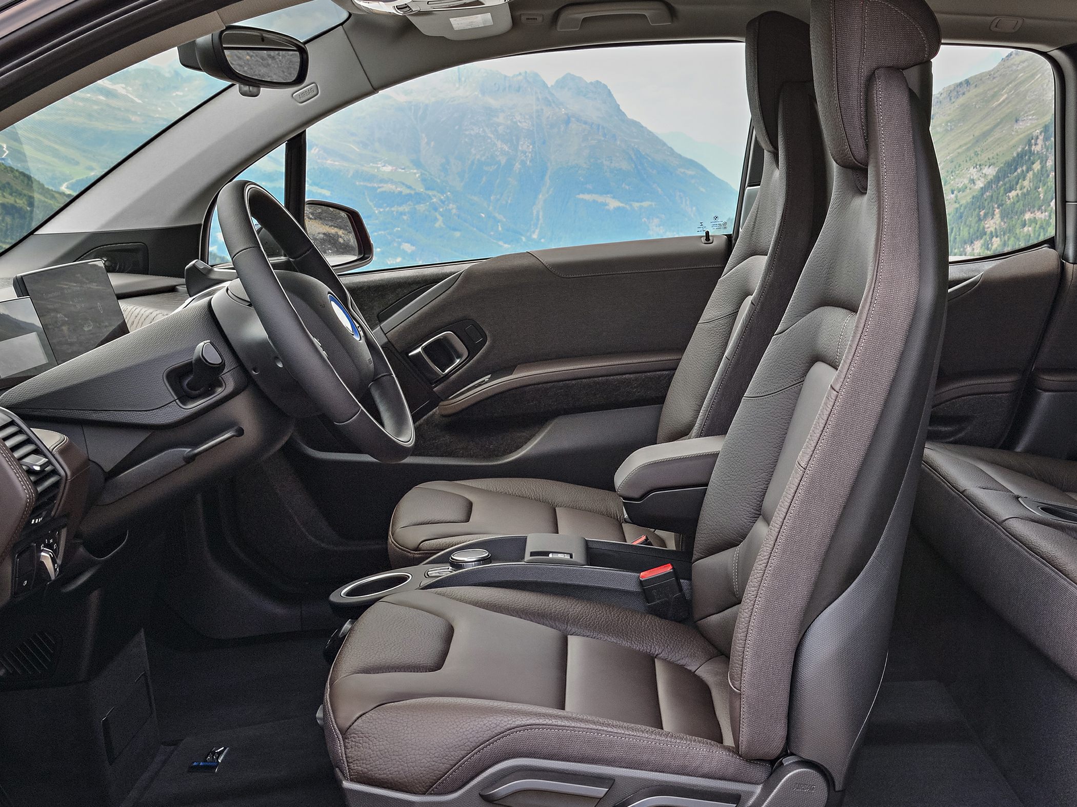 Front seats and dashboard interior of an electric car