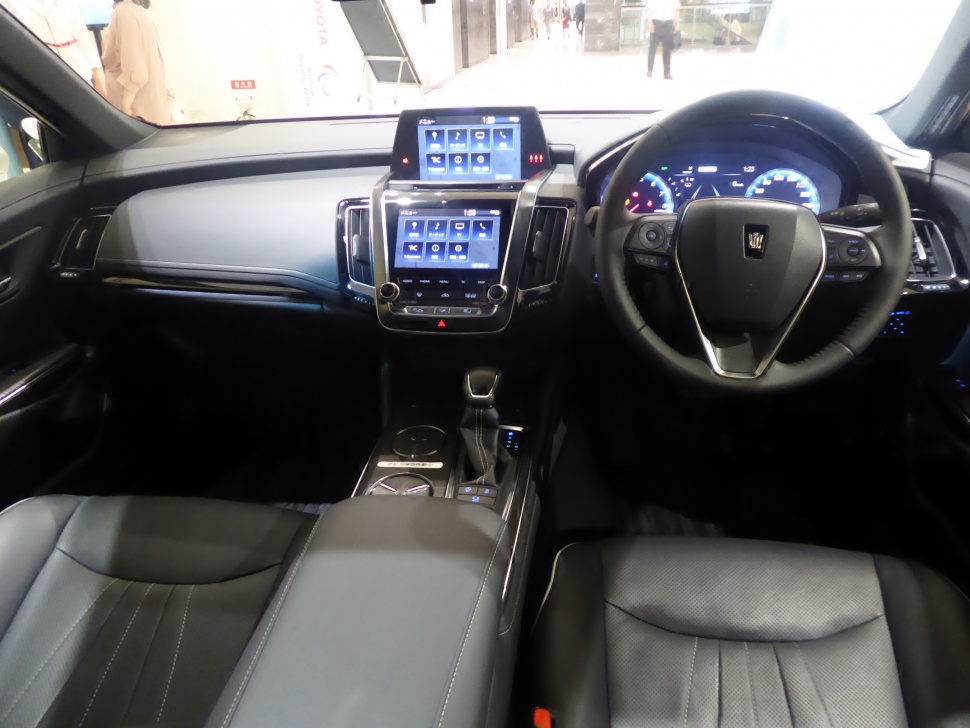 Toyota interior with dual touchscreen displays and digital instrument cluster.