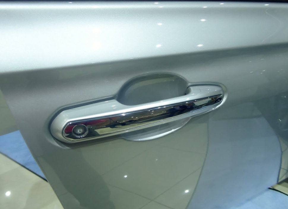 Chrome door handle with integrated camera on vehicle door